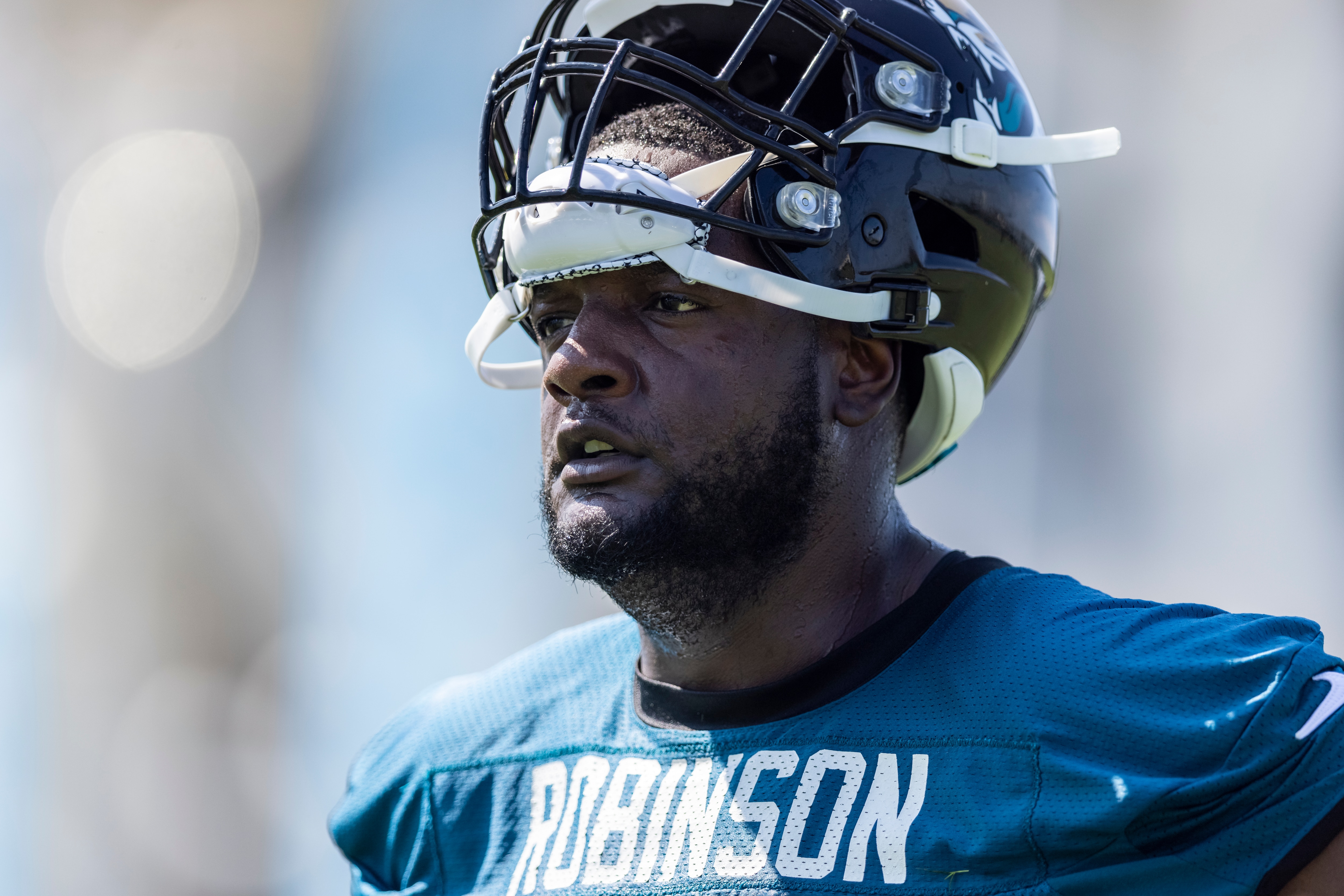JACKSONVILLE, FLORIDA - JULY 29: Cam Robinson #74 of the Jacksonville Jaguars looks on during Training Camp at TIAA Bank Field on July 29, 2021 in Jacksonville, Florida. (Photo by James Gilbert/Getty Images)