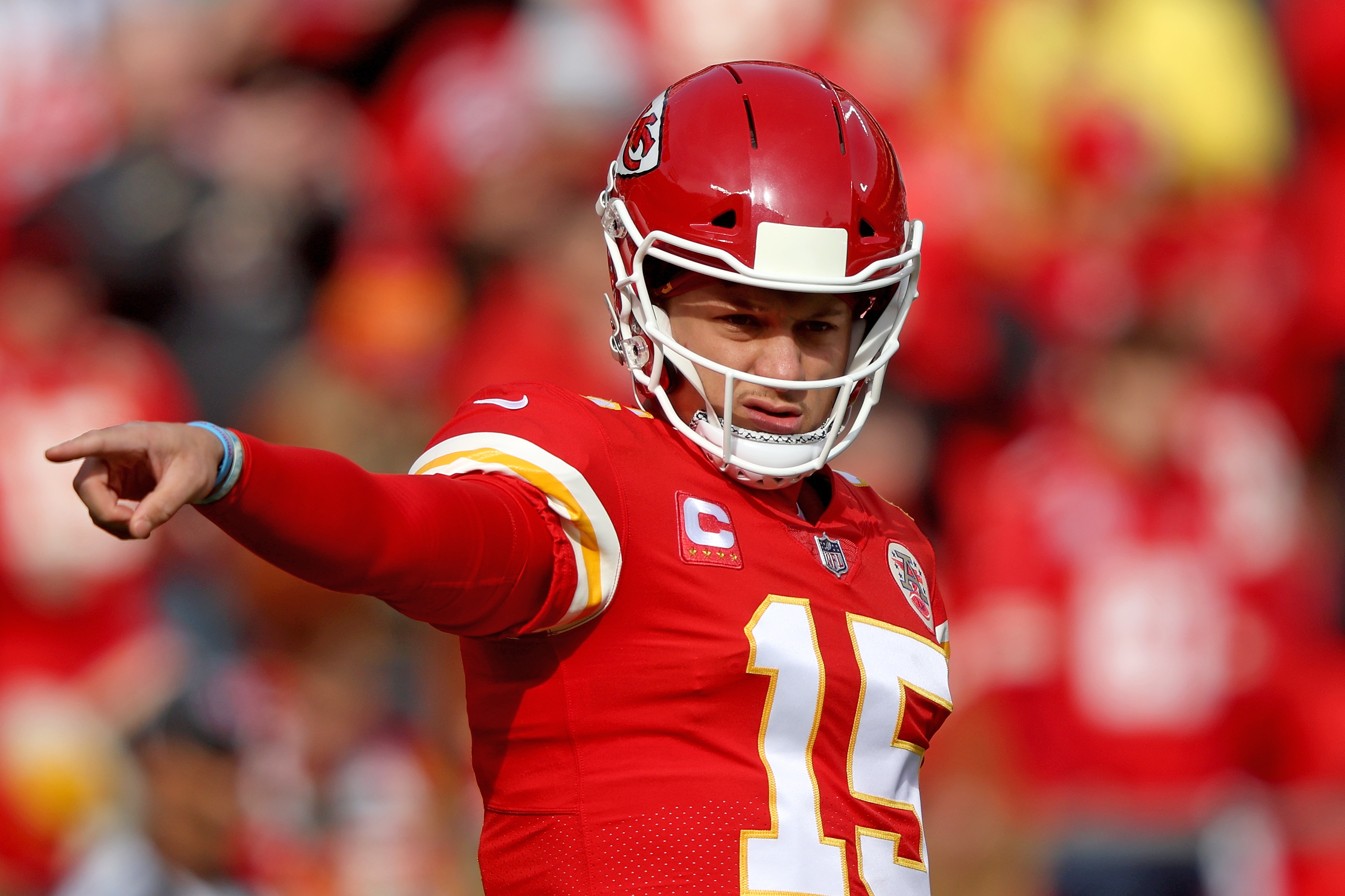 KANSAS CITY, MISSOURI - JANUARY 30: Quarterback Patrick Mahomes #15 of the Kansas City Chiefs motions from the line of scrimmage against the Cincinnati Bengals during the first half of the AFC Championship Game at Arrowhead Stadium on January 30, 2022 in Kansas City, Missouri. (Photo by Jamie Squire/Getty Images)