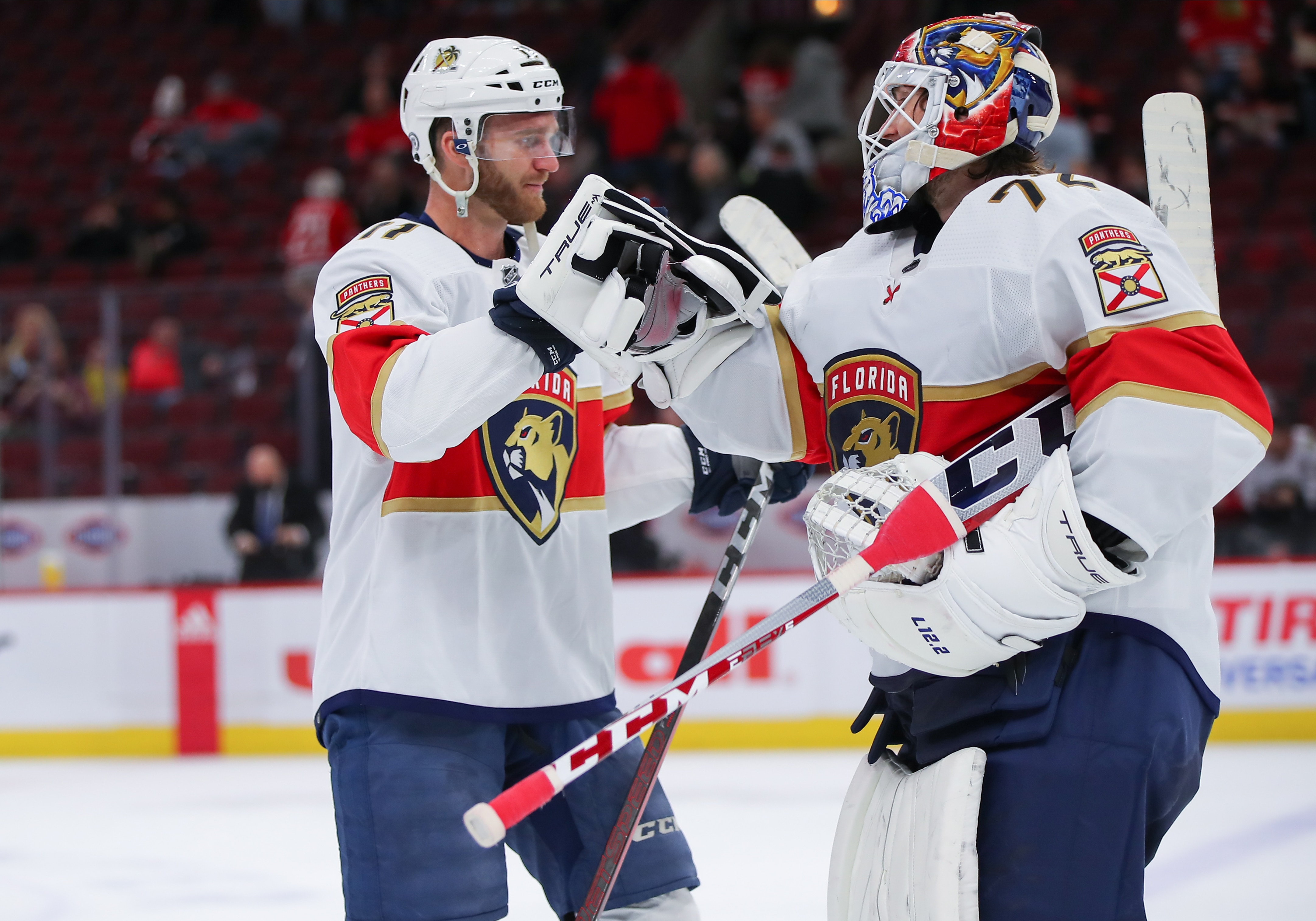 CHICAGO, IL - FEBRUARY 20: Florida Panthers left wing Jonathan Huberdeau (11) fist bumps Florida Panthers goaltender Sergei Bobrovsky (72) after a game between the Florida Panthers and the Chicago Blackhawks on February 20, 2022 at the United Center in Chicago, IL. (Photo by Melissa Tamez/Icon Sportswire via Getty Images)