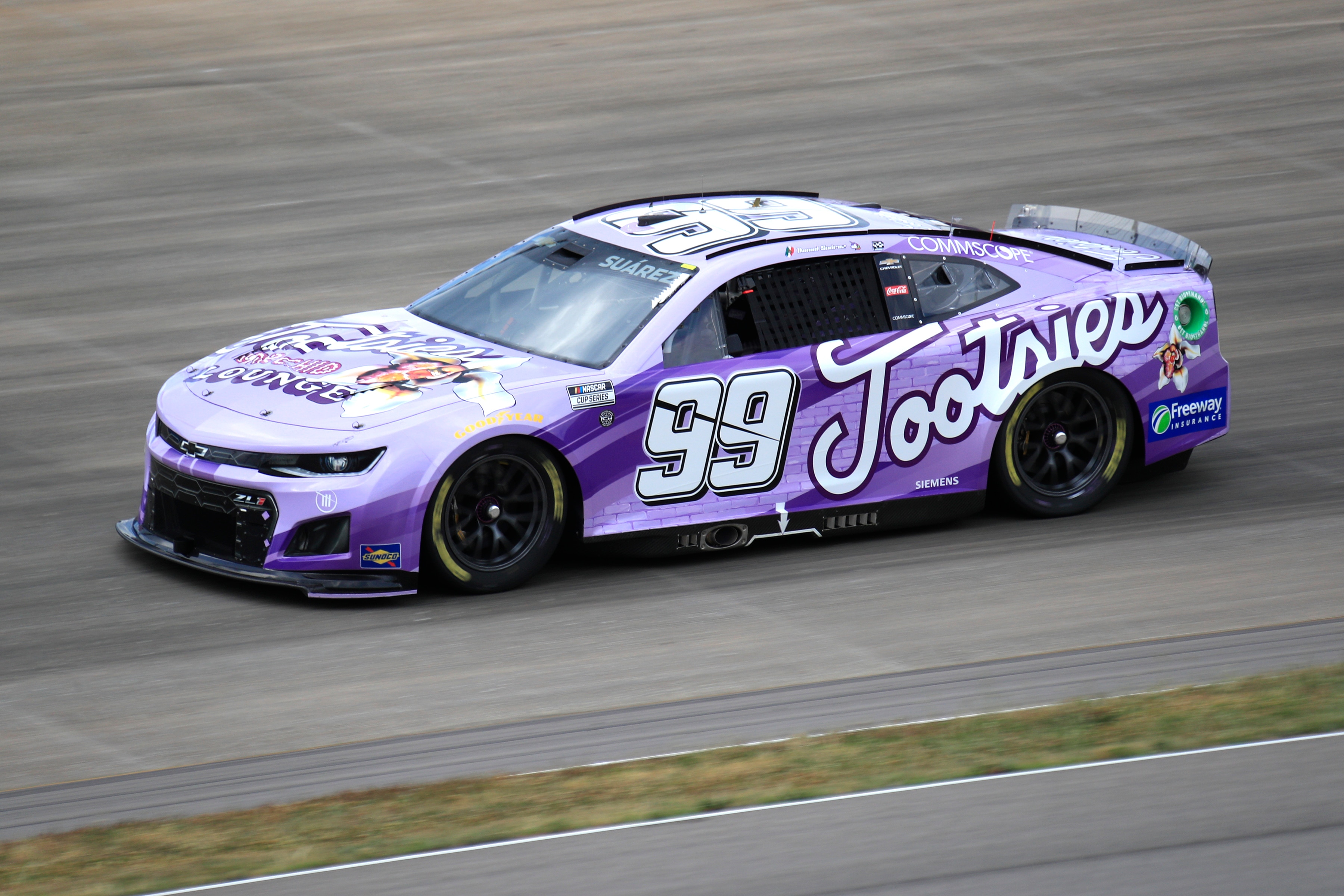 NASHVILLE, TN - JUNE 26: Daniel Suarez (#99 TrackHouse Racing Tootsies Orchid Lounge Chevrolet) races into turn three during the running of the 2nd annual NASCAR Cup Series Ally 400 on June 26, 2022 at Nashville SuperSpeedway in Nashville, TN. (Photo by Jeff Robinson/Icon Sportswire via Getty Images)