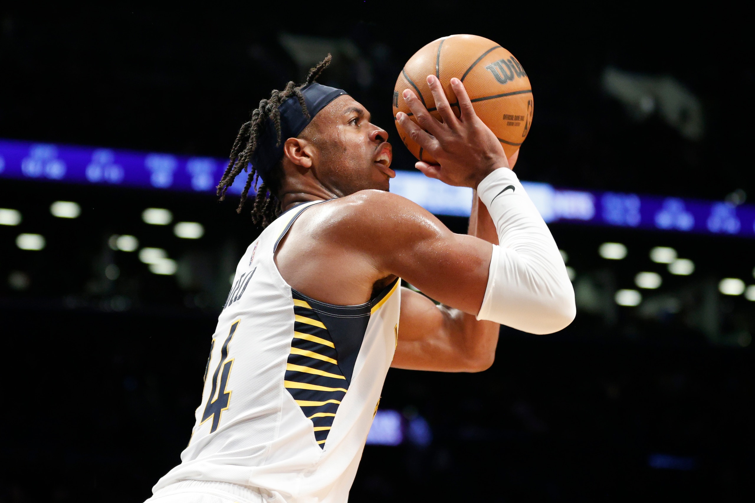 NEW YORK, NEW YORK - APRIL 10: Buddy Hield #24 of the Indiana Pacers shoots the ball during the second half against the Brooklyn Nets at Barclays Center on April 10, 2022 in the Brooklyn borough of New York City. The Nets won 134-126. NOTE TO USER: User expressly acknowledges and agrees that, by downloading and or using this photograph, User is consenting to the terms and conditions of the Getty Images License Agreement. (Photo by Sarah Stier/Getty Images)
