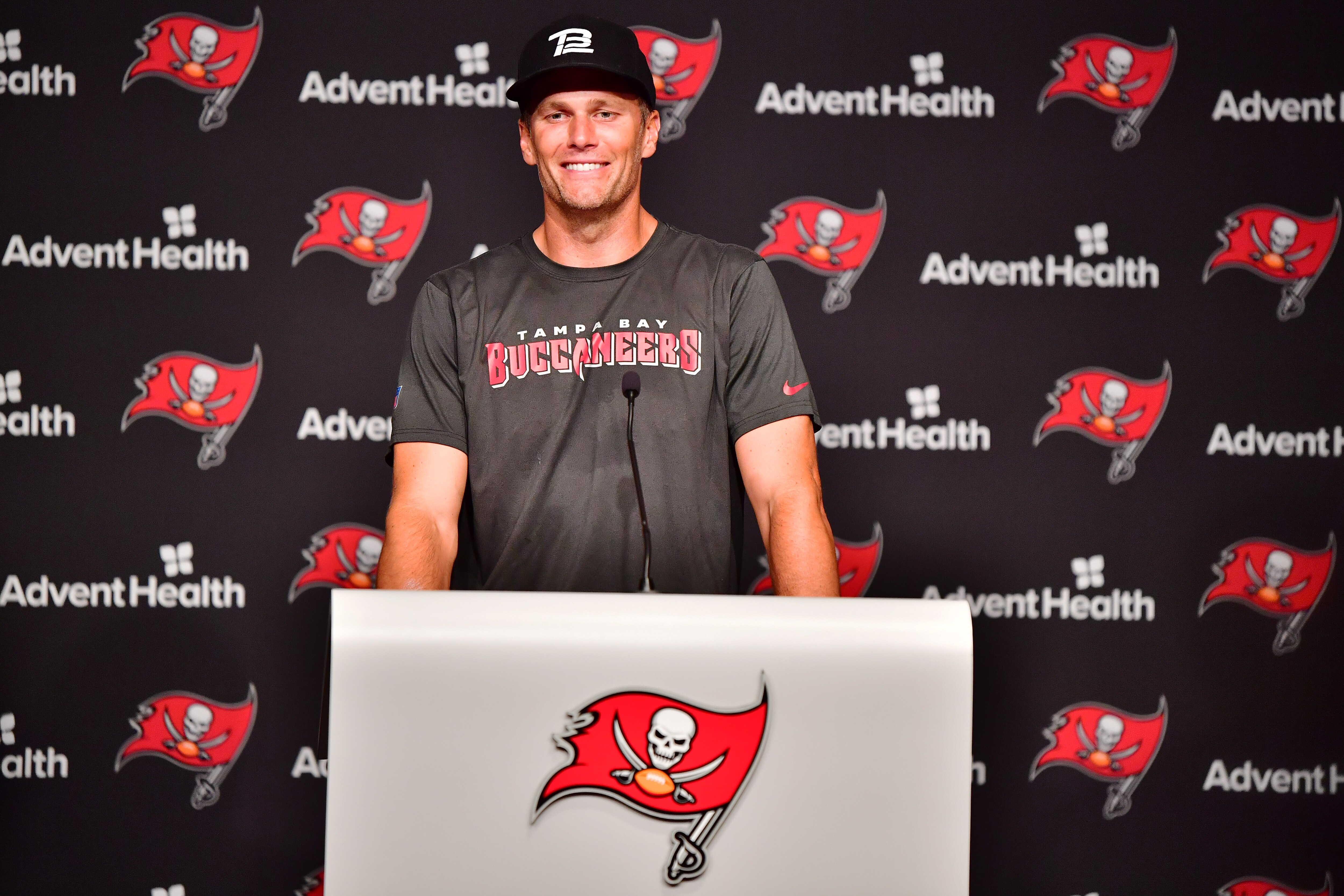 TAMPA, FLORIDA - JUNE 09: Tom Brady #12 of Tampa Bay Buccaneers answers questions at a press conference following the 2022 Buccaneers minicamp at AdventHealth Training Center on June 09, 2022 in Tampa, Florida. (Photo by Julio Aguilar/Getty Images)