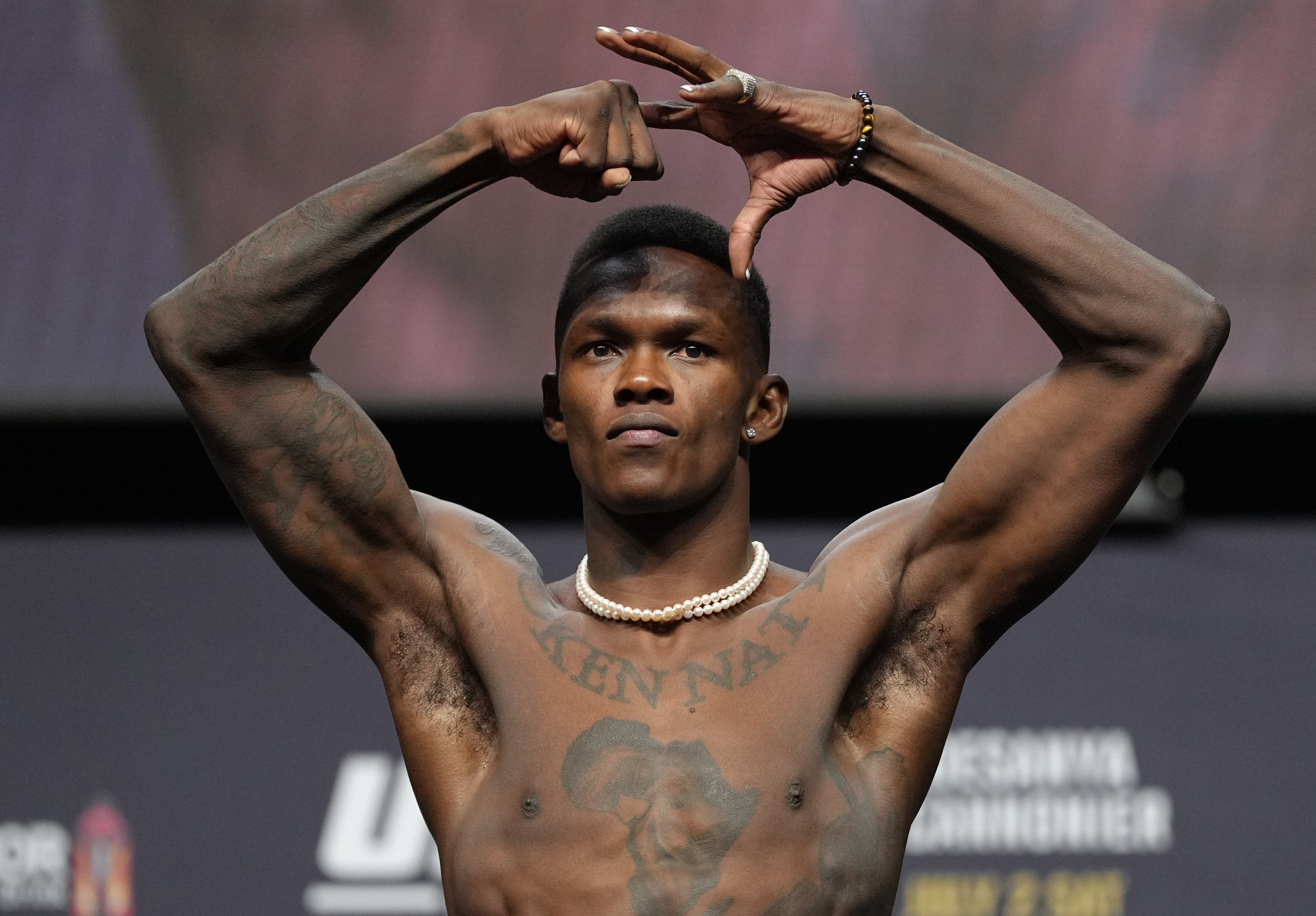 LAS VEGAS, NEVADA - JULY 01: Israel Adesanya of Nigeria poses on the scale during the UFC 276 ceremonial weigh-in at T-Mobile Arena on July 01, 2022 in Las Vegas, Nevada. (Photo by Jeff Bottari/Zuffa LLC)