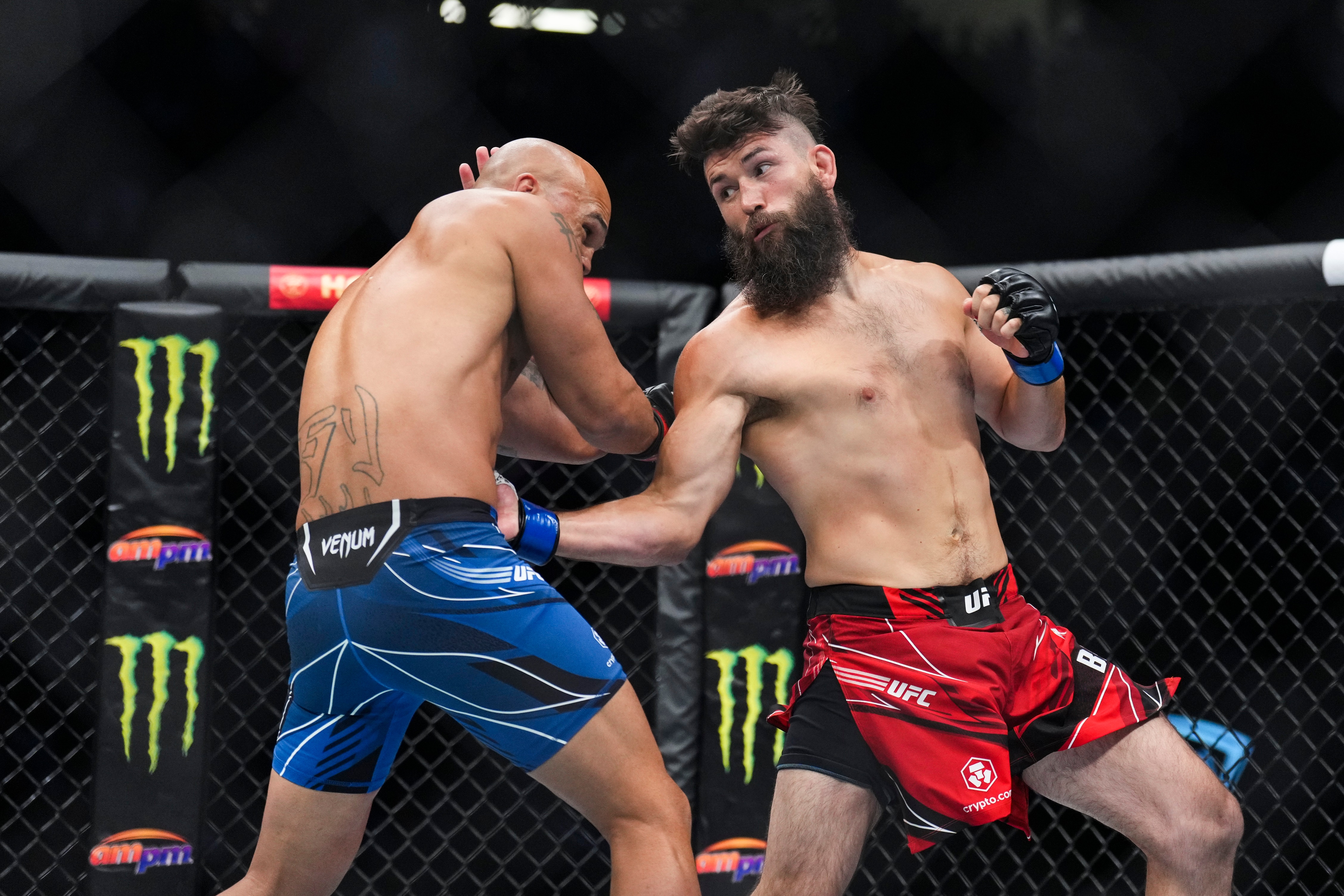 LAS VEGAS, NEVADA - JULY 02: Bryan Barberena punches Robbie Lawler in a welterweight fight during the UFC 276 event at T-Mobile Arena on July 02, 2022 in Las Vegas, Nevada. (Photo by Chris Unger/Zuffa LLC)