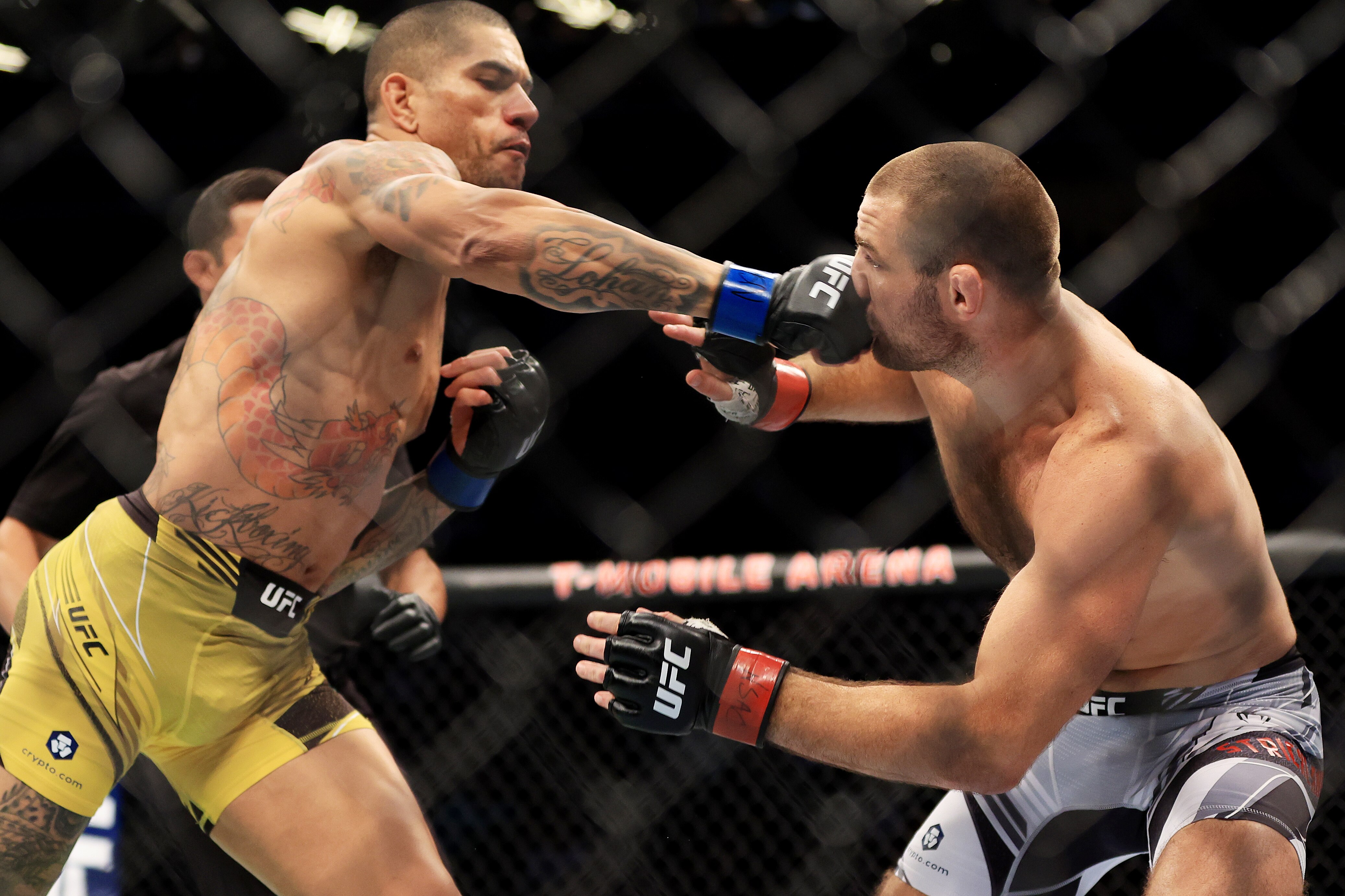 LAS VEGAS, NEVADA - JULY 02: Alex Pereira (L) of Brazil knocks out Sean Strickland in the first round of their middleweight bout during UFC 276 at T-Mobile Arena on July 02, 2022 in Las Vegas, Nevada. (Photo by Carmen Mandato/Getty Images)