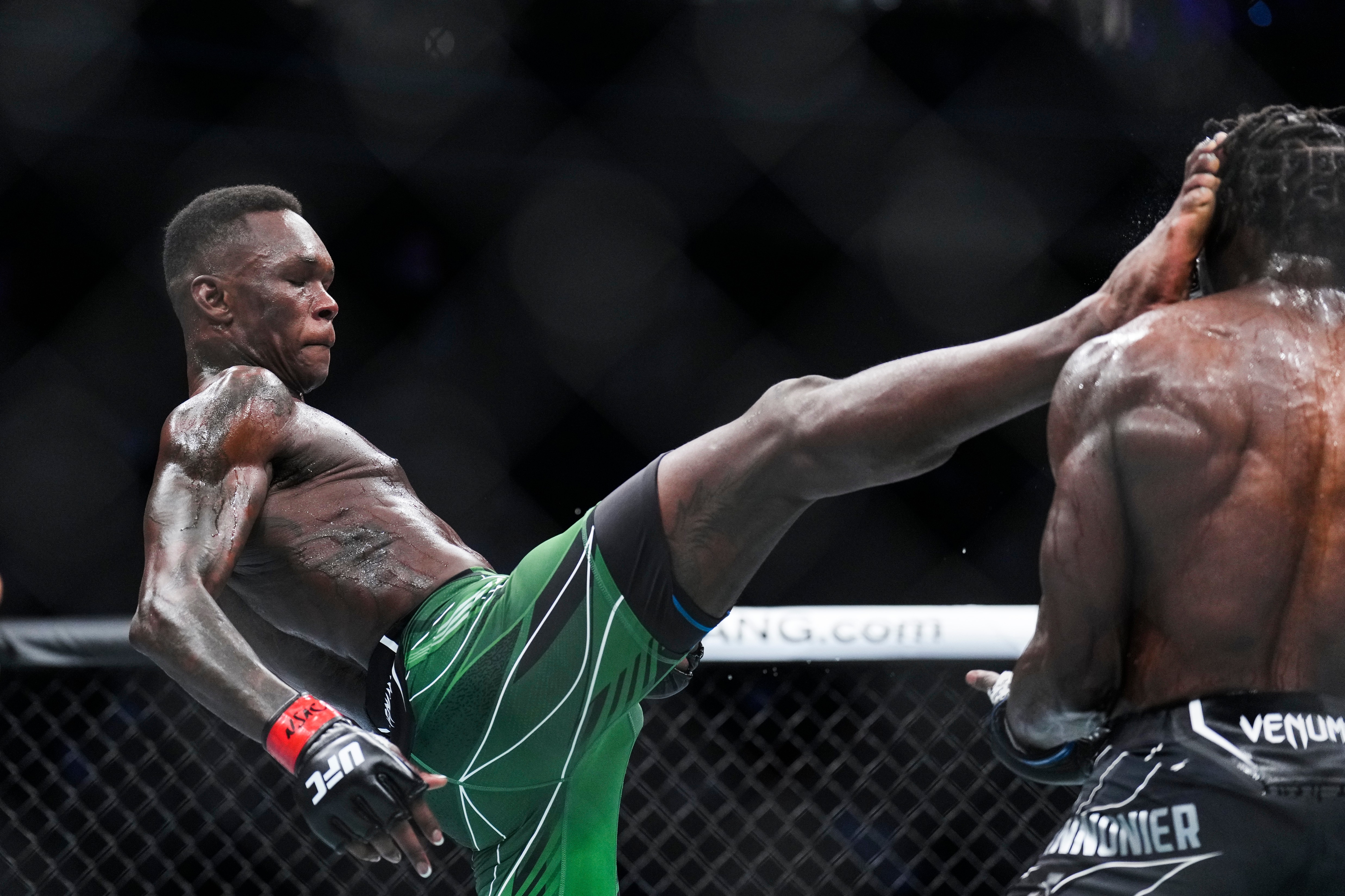 LAS VEGAS, NEVADA - JULY 02: Israel Adesanya of Nigeria kicks Jared Cannonier in the UFC middleweight championship fight during the UFC 276 event at T-Mobile Arena on July 02, 2022 in Las Vegas, Nevada. (Photo by Chris Unger/Zuffa LLC)
