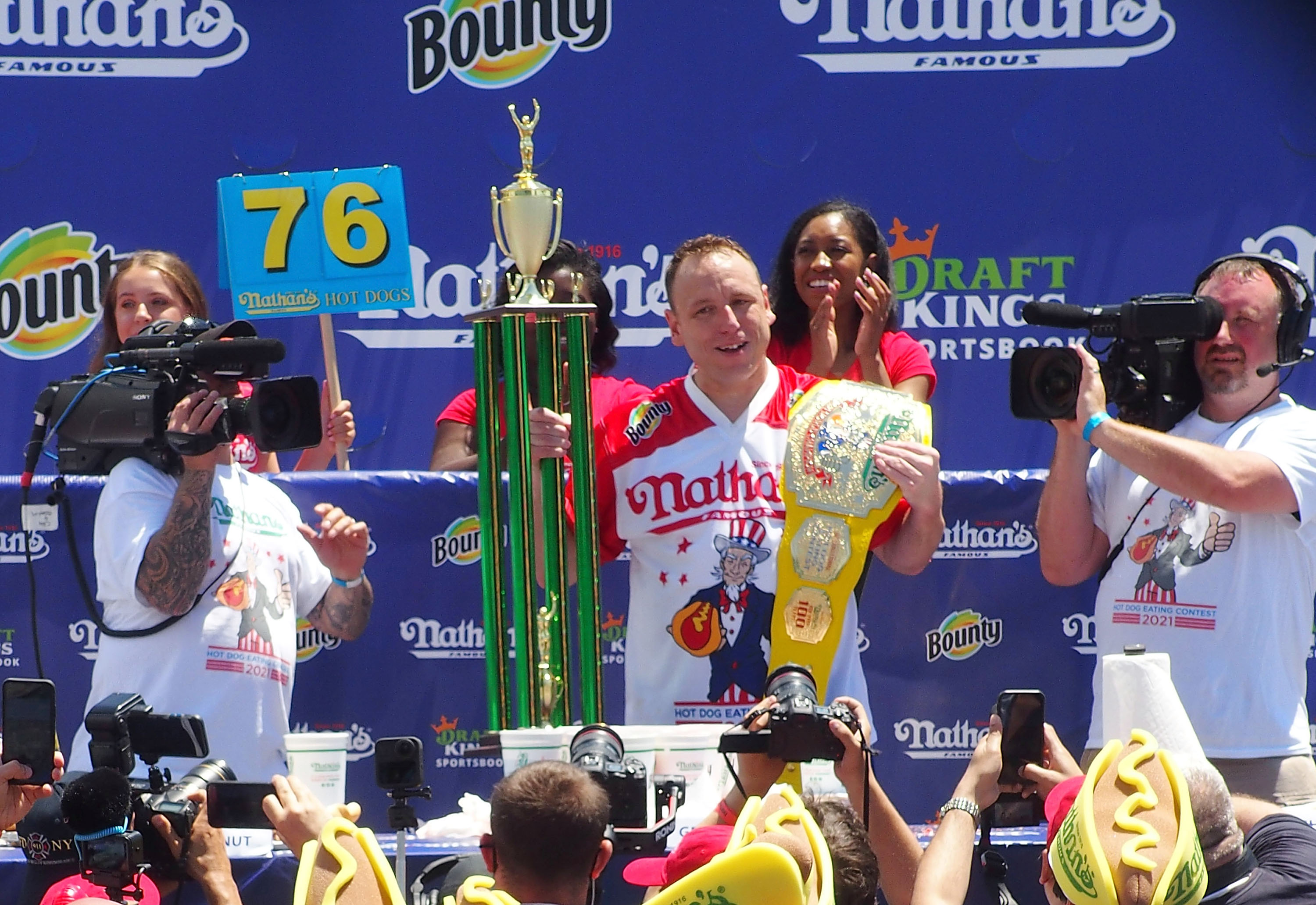 NEW YORK, NY - JULY 04:  Defending Champion Joey Chestnut wins after consuming 76 hot dogs and setting a new world record at the 2021 Nathan's Famous International Hot Dog Eating Contest at Coney Island on July 4, 2021 in New York City.  (Photo by Bobby Bank/WireImage)