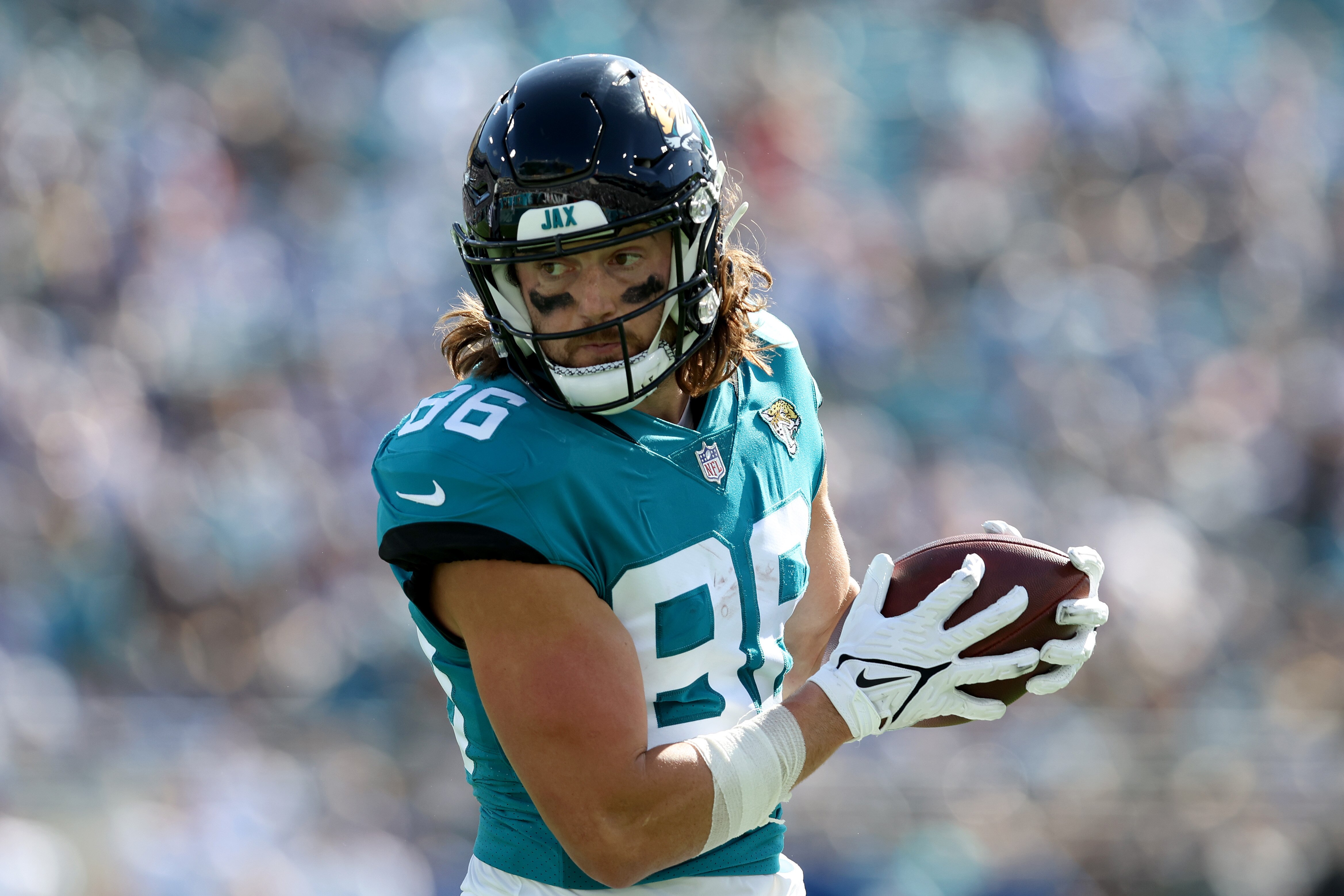 JACKSONVILLE, FLORIDA - JANUARY 09: Jacob Hollister #86 of the Jacksonville Jaguars runs for yardage during the game against the Indianapolis Colts at TIAA Bank Field on January 09, 2022 in Jacksonville, Florida. (Photo by Sam Greenwood/Getty Images)