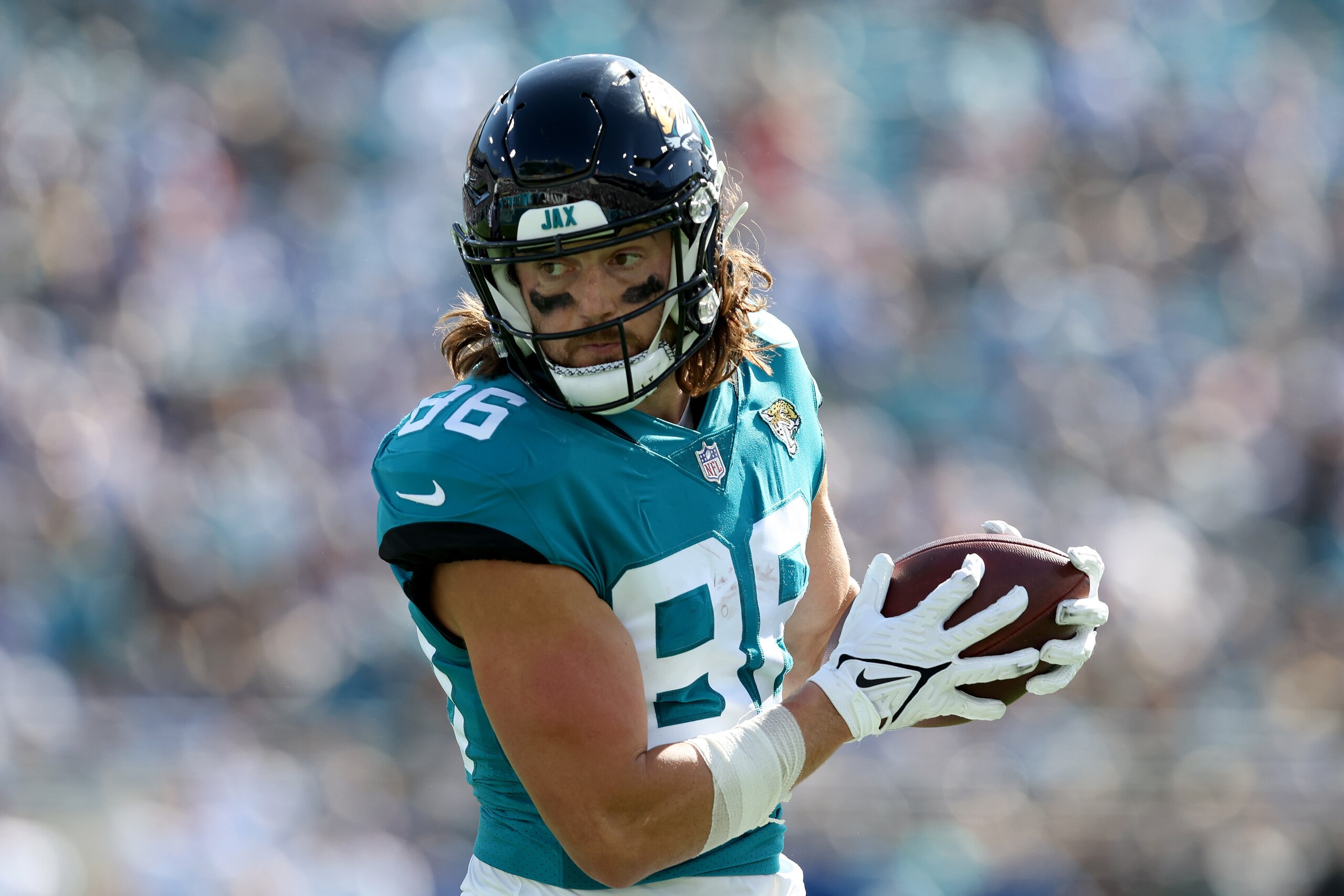 JACKSONVILLE, FLORIDA - JANUARY 09: Jacob Hollister #86 of the Jacksonville Jaguars runs for yardage during the game against the Indianapolis Colts at TIAA Bank Field on January 09, 2022 in Jacksonville, Florida. (Photo by Sam Greenwood/Getty Images)