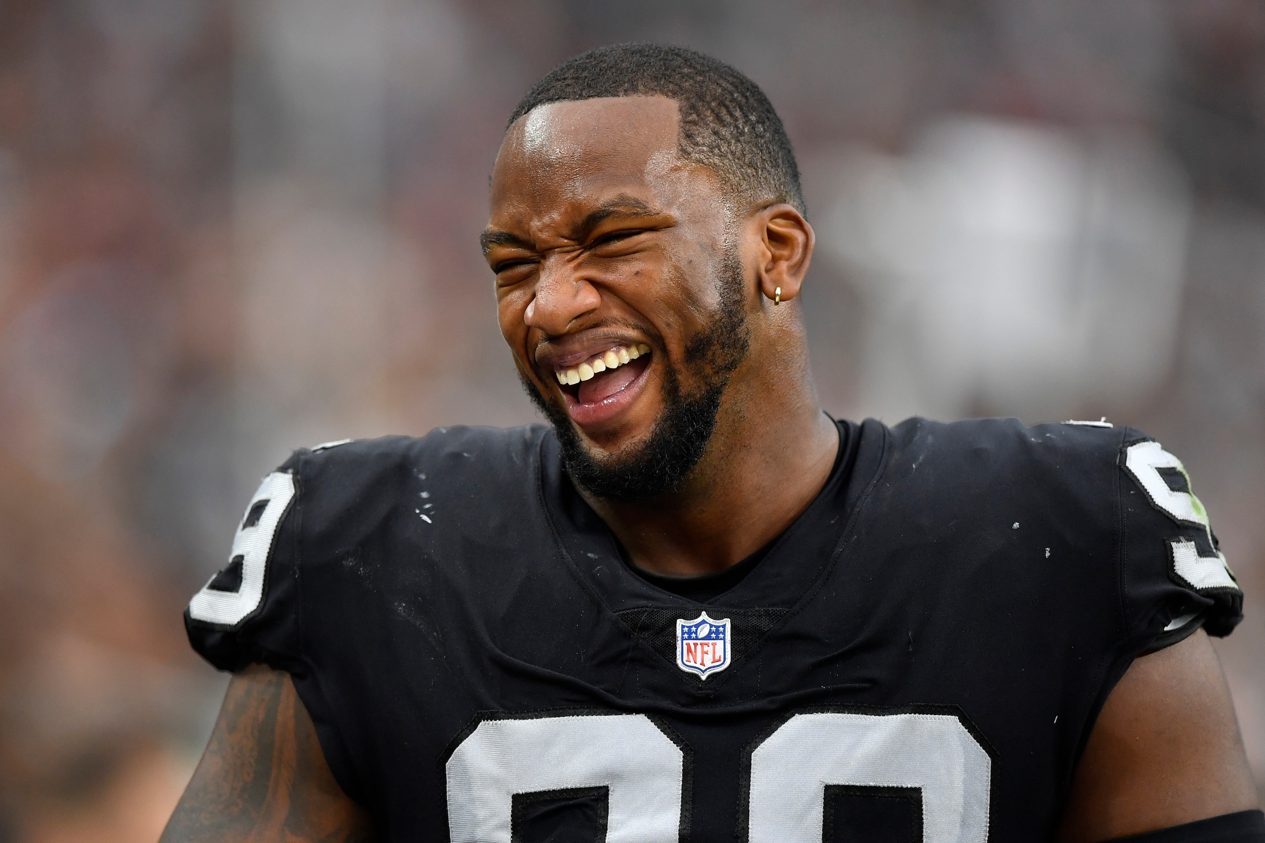 LAS VEGAS, NEVADA - SEPTEMBER 26:  Defensive end Clelin Ferrell #99 of the Las Vegas Raiders laughs during a game against the Miami Dolphins at Allegiant Stadium on September 26, 2021 in Las Vegas, Nevada. The Raiders defeated the Dolphins 31-28 in overtime. (Photo by Chris Unger/Getty Images)