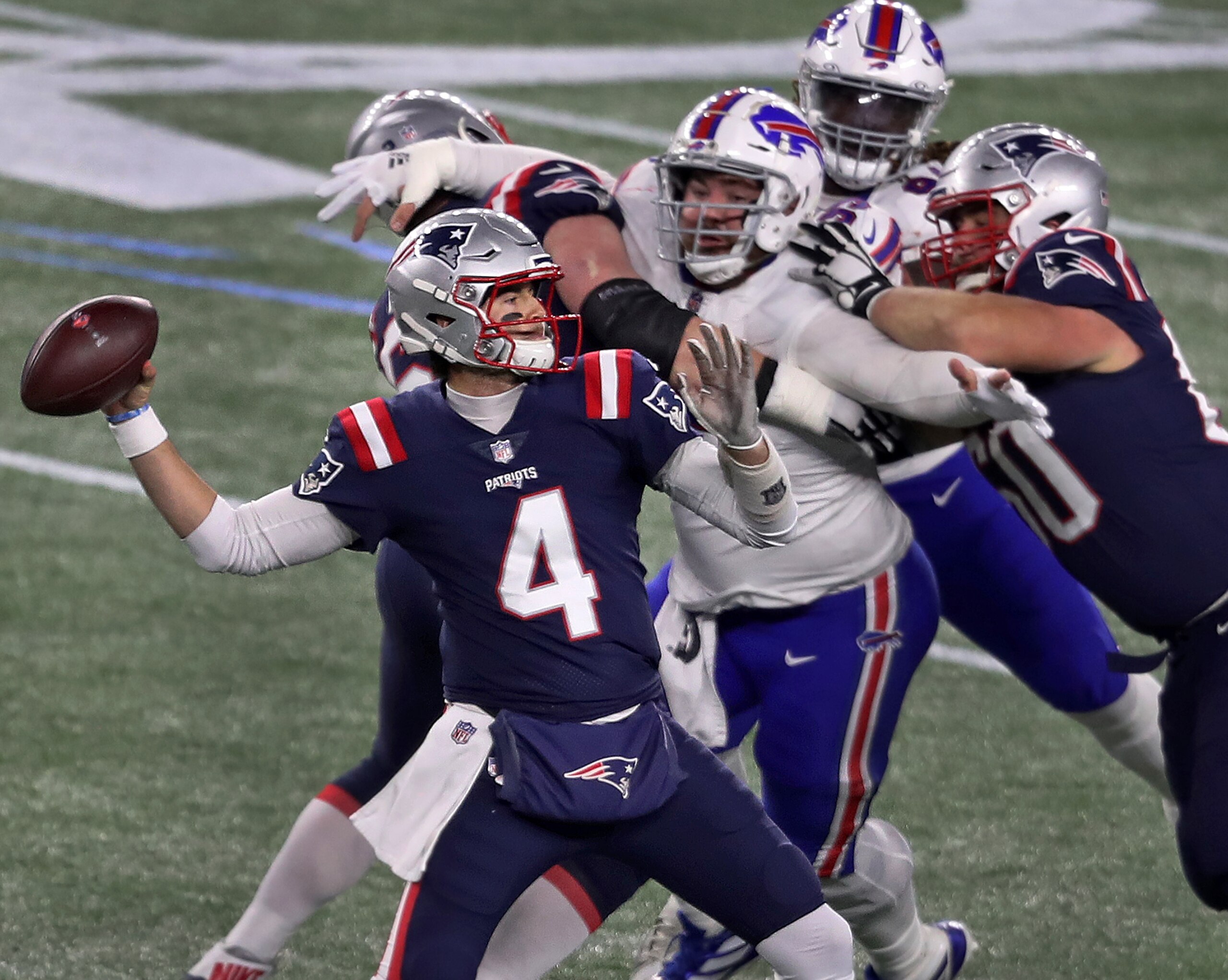 FOXBOROUGH, MA - DECEMBER 28: New England Patriots quarterback Jarrett Stidham fires a third quarter pass. The New England Patriots host the Buffalo Bills in an NFL Monday Night Football game at Gillette Stadium in Foxborough, MA on Dec. 28, 2020. (Photo by Jim Davis/The Boston Globe via Getty Images)