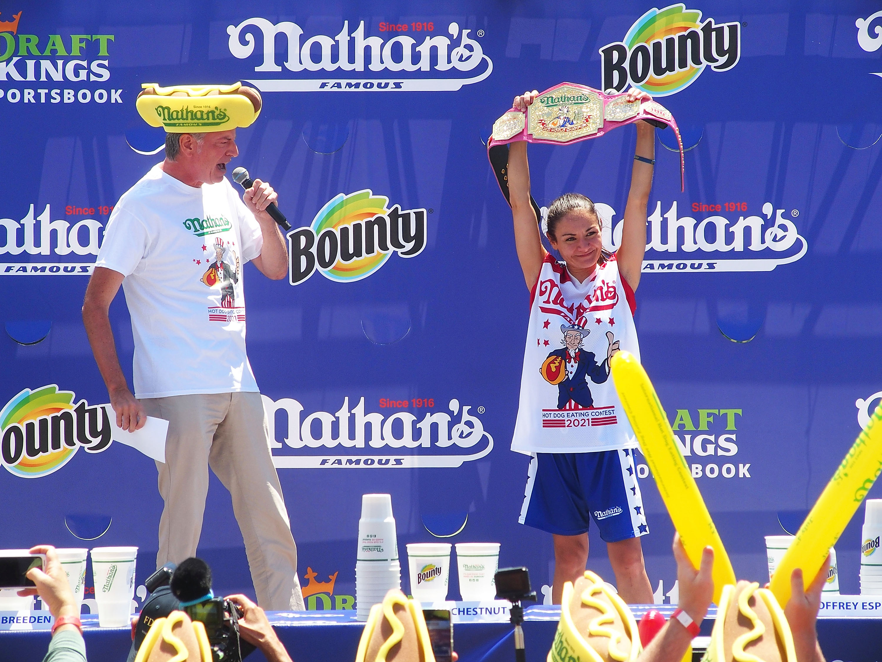 NEW YORK, NY - JULY 04:  Mayor of New York City Bill de Blasio and women's champion Michelle Lesco at the 2021 Nathan's Famous International Hot Dog Eating Contest at Coney Island on July 4, 2021 in New York City.  (Photo by Bobby Bank/WireImage)