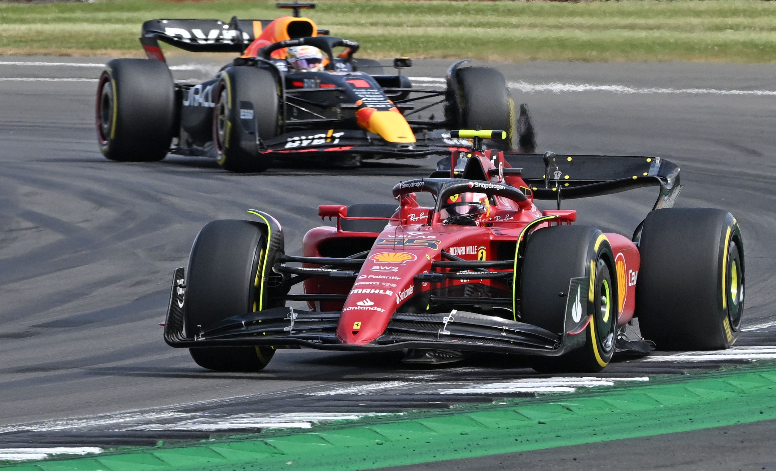 Ferrari's Spanish driver Carlos Sainz Jr (R) leads Red Bull Racing's Dutch driver Max Verstappen during the Formula One British Grand Prix at the Silverstone motor racing circuit in Silverstone, central England on July 3, 2022. (Photo by JUSTIN TALLIS / AFP) (Photo by JUSTIN TALLIS/AFP via Getty Images)