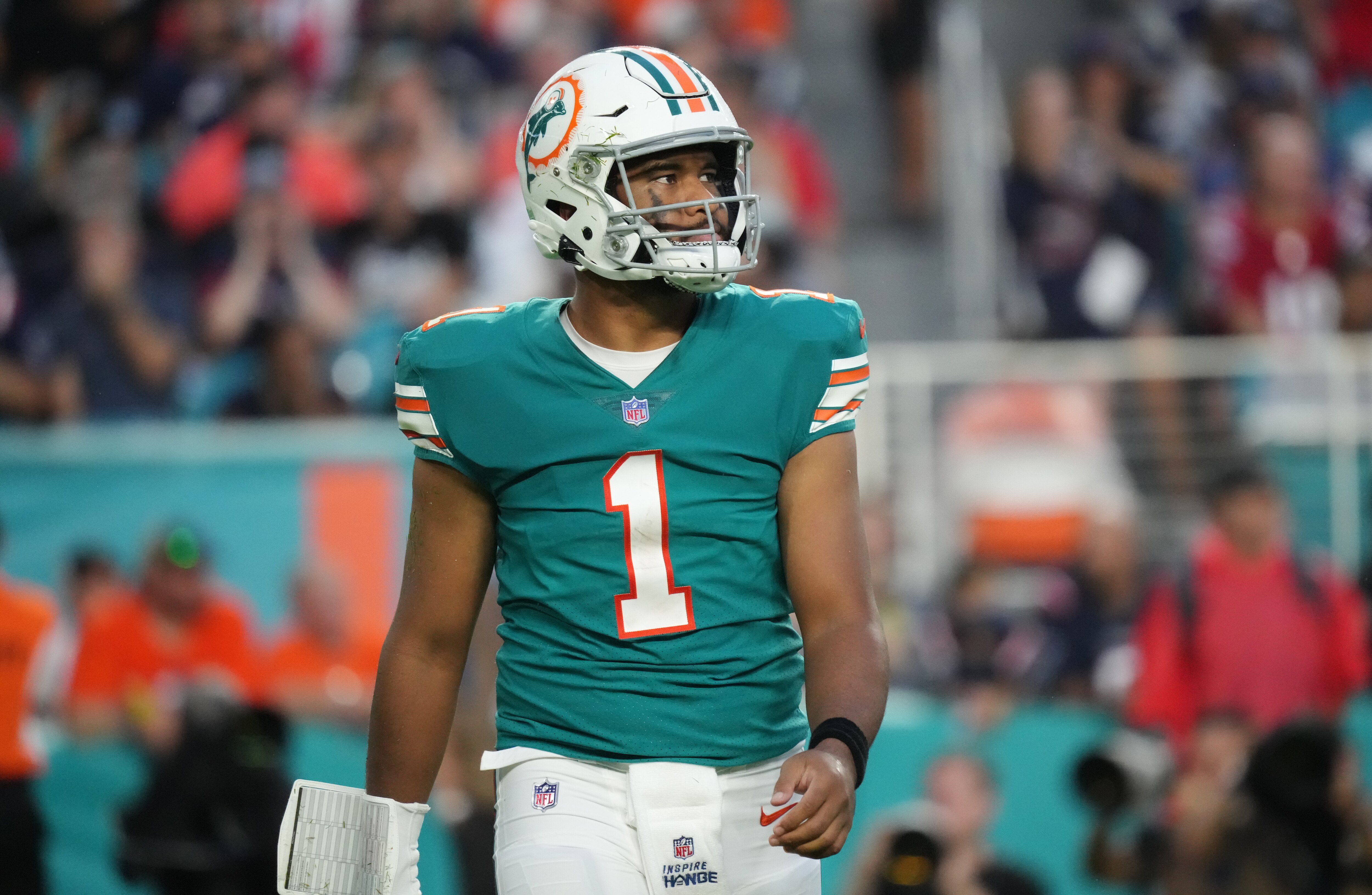 MIAMI GARDENS, FLORIDA - JANUARY 09: Tua Tagovailoa #1 of the Miami Dolphins in action against the New England Patriots at Hard Rock Stadium on January 09, 2022 in Miami Gardens, Florida. (Photo by Mark Brown/Getty Images)