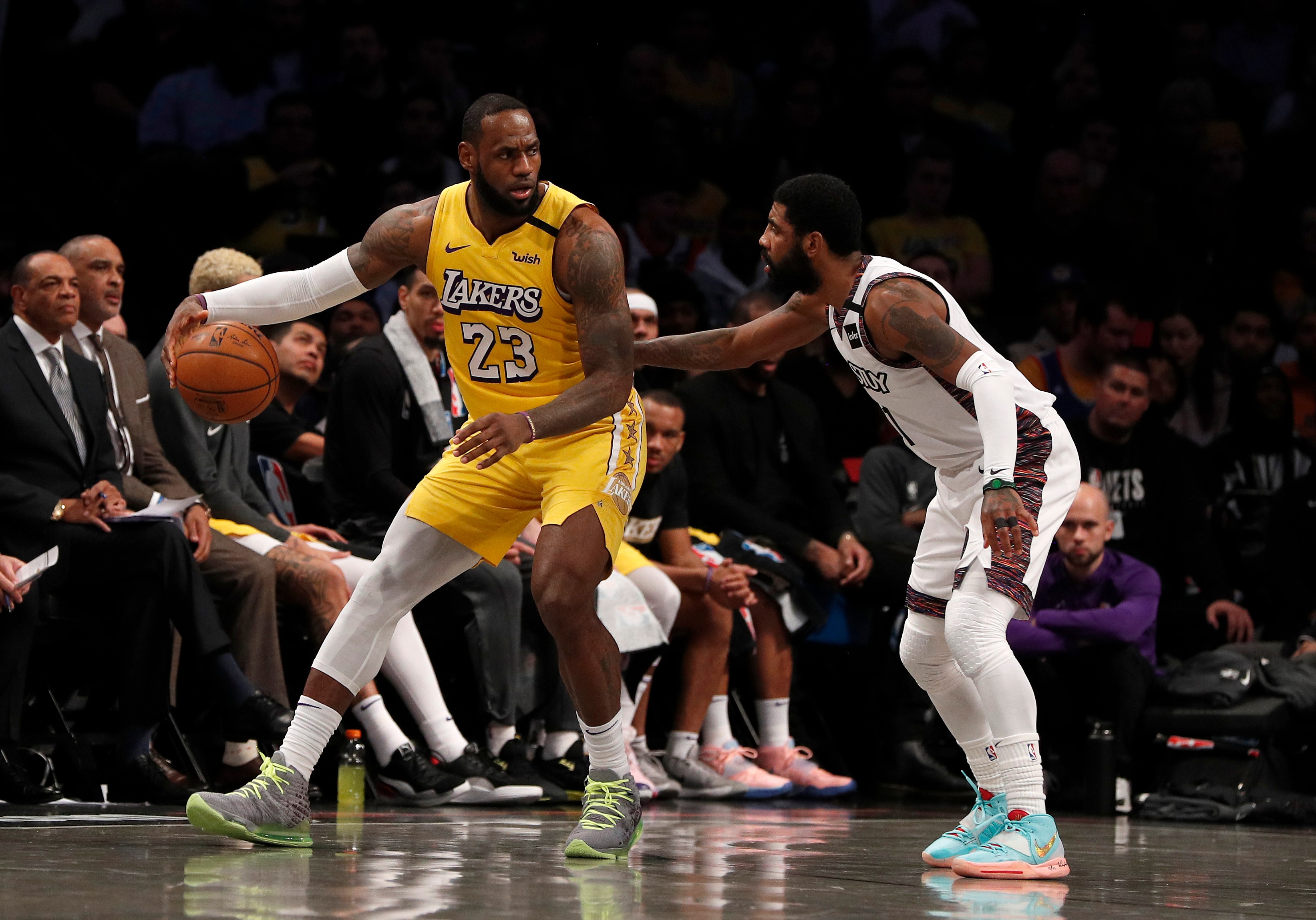 NEW YORK, NEW YORK - JANUARY 23:  (NEW YORK DAILIES OUT)   LeBron James #23 of the Los Angeles Lakers in action against Kyrie Irving #11 of the Brooklyn Nets at Barclays Center on January 23, 2020 in New York City. The Lakers defeated the Nets 128-113. NOTE TO USER: User expressly acknowledges and agrees that, by downloading and or using this photograph, User is consenting to the terms and conditions of the Getty Images License Agreement. (Photo by Jim McIsaac/Getty Images)