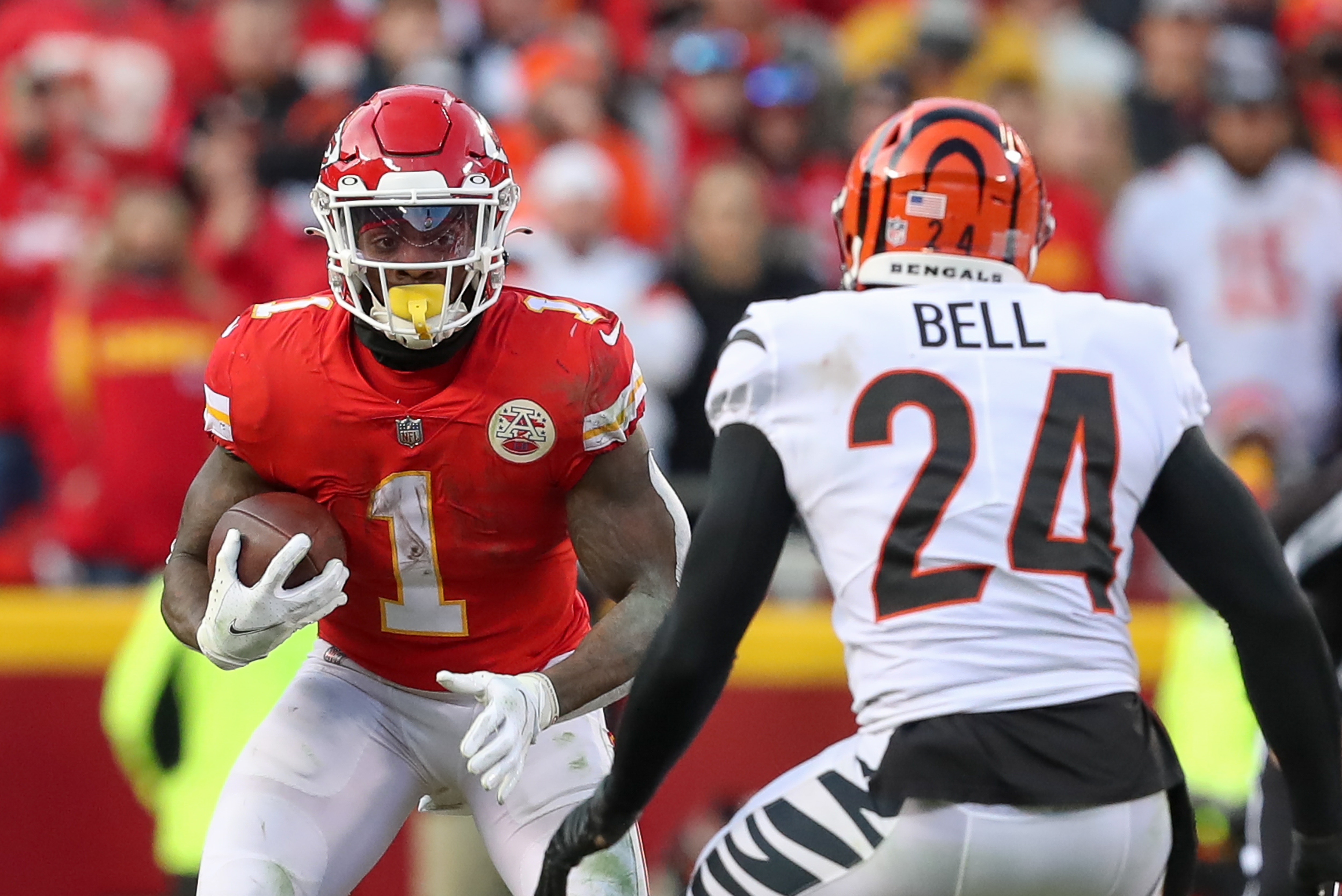KANSAS CITY, MO - JANUARY 30: Kansas City Chiefs running back Jerick McKinnon (1) looks for running room as Cincinnati Bengals safety Vonn Bell (24) closes in during the fourth quarter of the AFC Championship game between the Cincinnati Bengals and Kansas City Chiefs on Jan 30, 2022 at GEHA Field at Arrowhead Stadium in Kansas City, MO. (Photo by Scott Winters/Icon Sportswire via Getty Images)