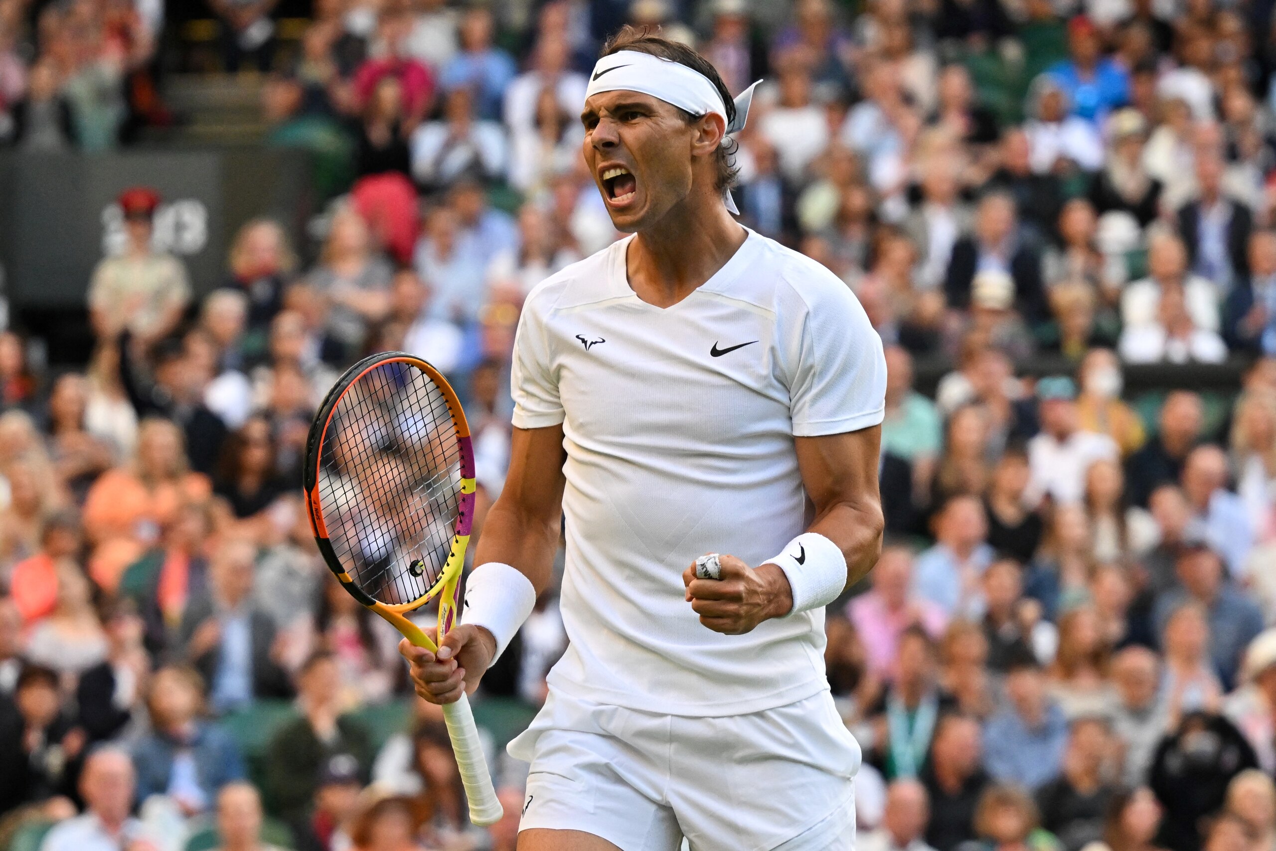 TOPSHOT - Spain's Rafael Nadal celebrates winning a point against Netherlands' Botic van de Zandschulp during their round of 16 men's singles tennis match on the eighth day of the 2022 Wimbledon Championships at The All England Tennis Club in Wimbledon, southwest London, on July 4, 2022. - RESTRICTED TO EDITORIAL USE (Photo by Glyn KIRK / AFP) / RESTRICTED TO EDITORIAL USE (Photo by GLYN KIRK/AFP via Getty Images)