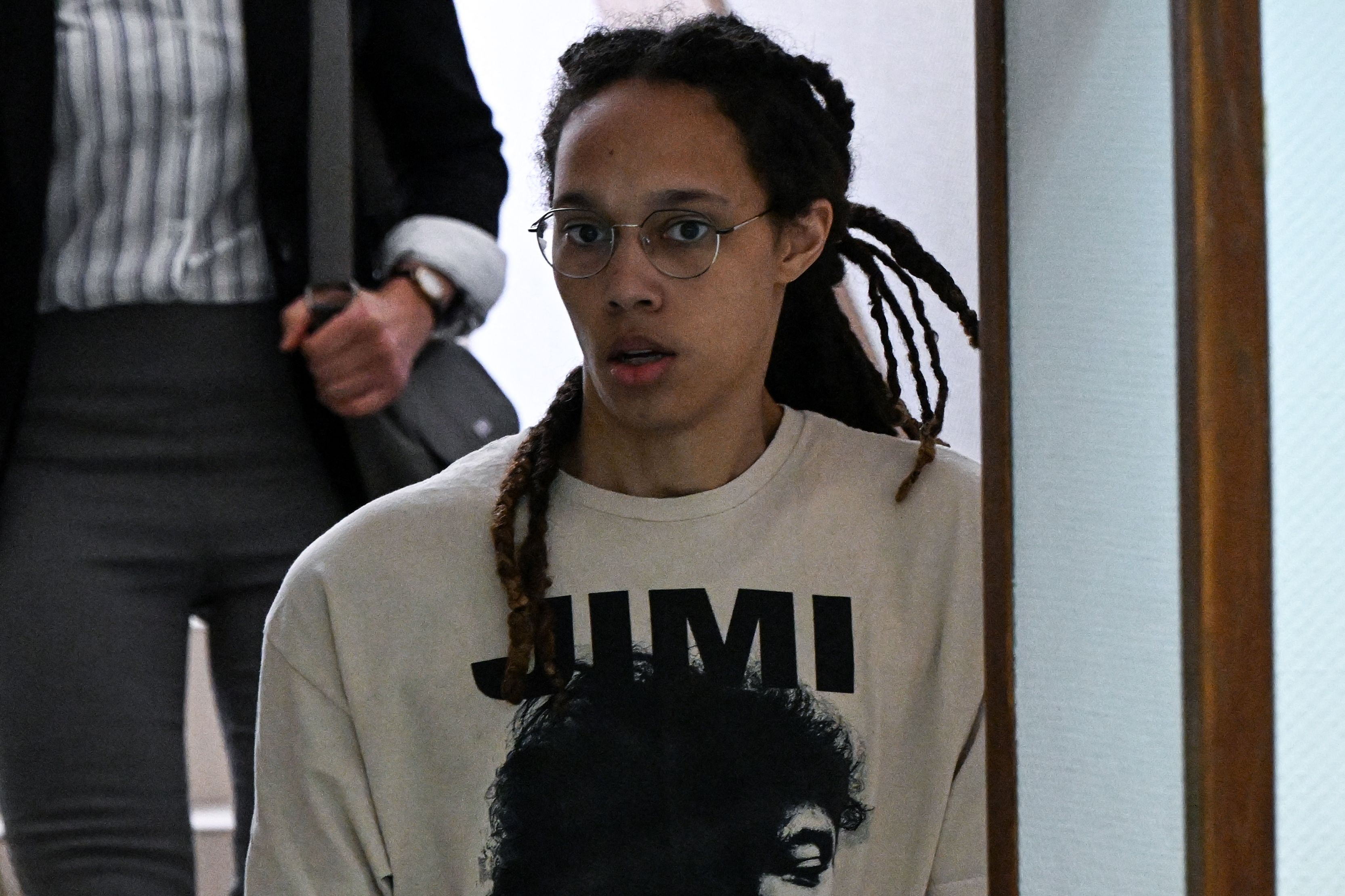 US WNBA basketball superstar Brittney Griner arrives to a hearing at the Khimki Court, outside Moscow on July 1, 2022. - Griner, a two-time Olympic gold medallist and WNBA champion, was detained at Moscow airport in February on charges of carrying in her luggage vape cartridges with cannabis oil, which could carry a 10-year prison sentence. (Photo by Kirill KUDRYAVTSEV / AFP) (Photo by KIRILL KUDRYAVTSEV/AFP via Getty Images)