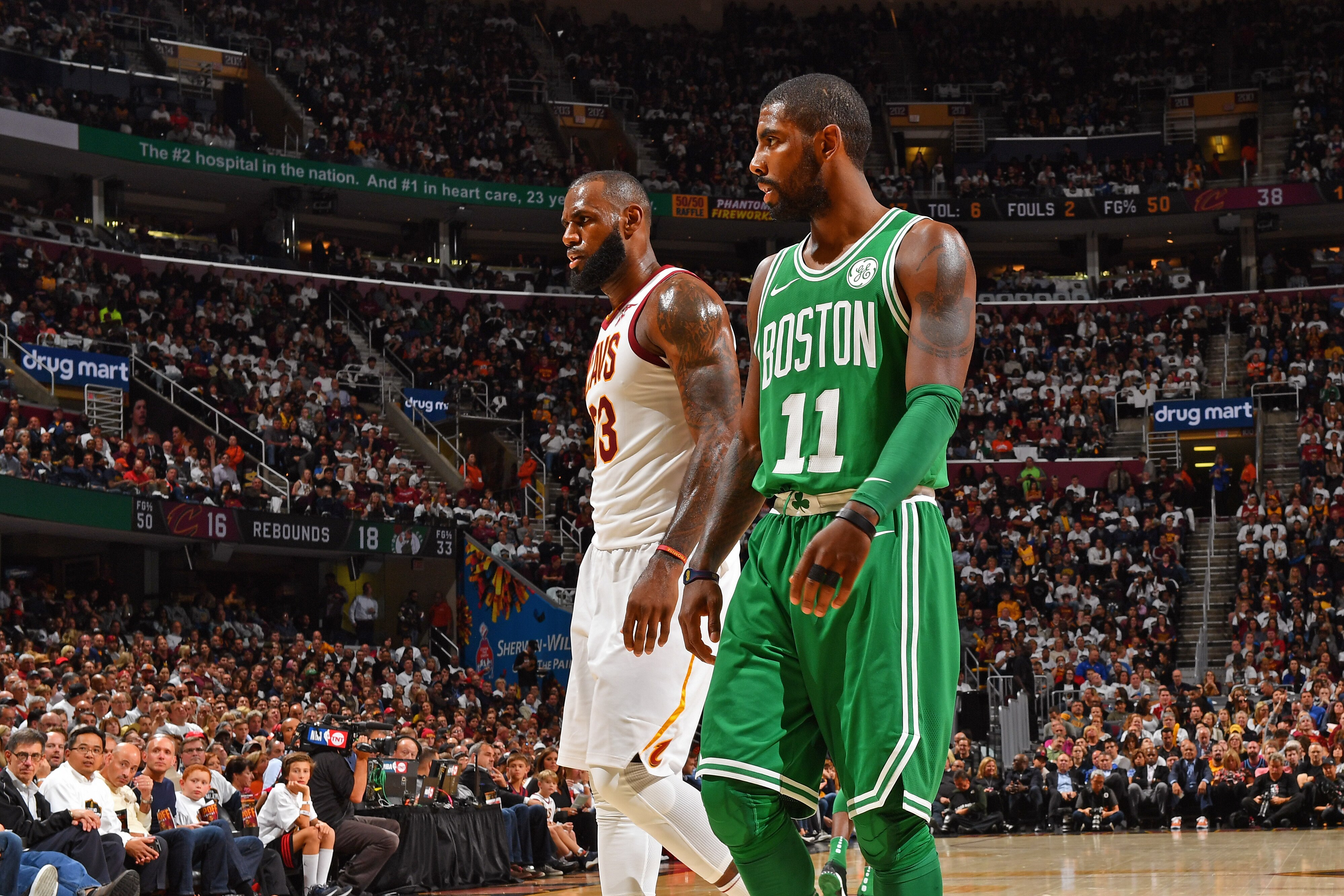 CLEVELAND, OH - OCTOBER 17:  Kyrie Irving #11 of the Boston Celtics and LeBron James #23 of the Cleveland Cavaliers walk up court on October 17, 2017 at Quicken Loans Arena in Cleveland, Ohio. NOTE TO USER: User expressly acknowledges and agrees that, by downloading and/or using this Photograph, user is consenting to the terms and conditions of the Getty Images License Agreement. Mandatory Copyright Notice: Copyright 2017 NBAE (Photo by Jesse D. Garrabrant/NBAE via Getty Images)