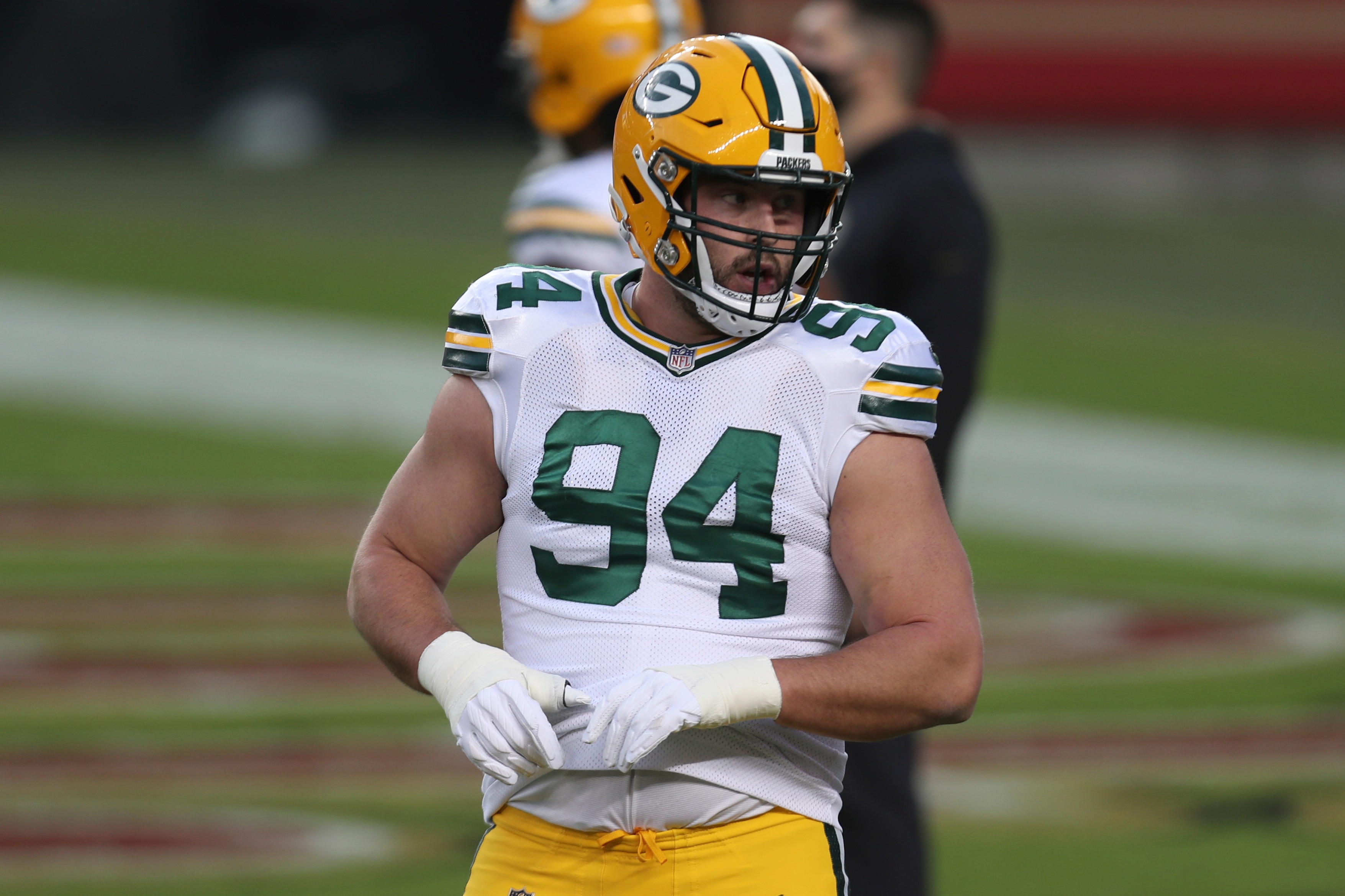 Green Bay Packers defensive end Dean Lowry (94) warms up before an NFL football game against the San Francisco 49ers in Santa Clara, Calif., Thursday, Nov. 5, 2020. (AP Photo/Jed Jacobsohn)
