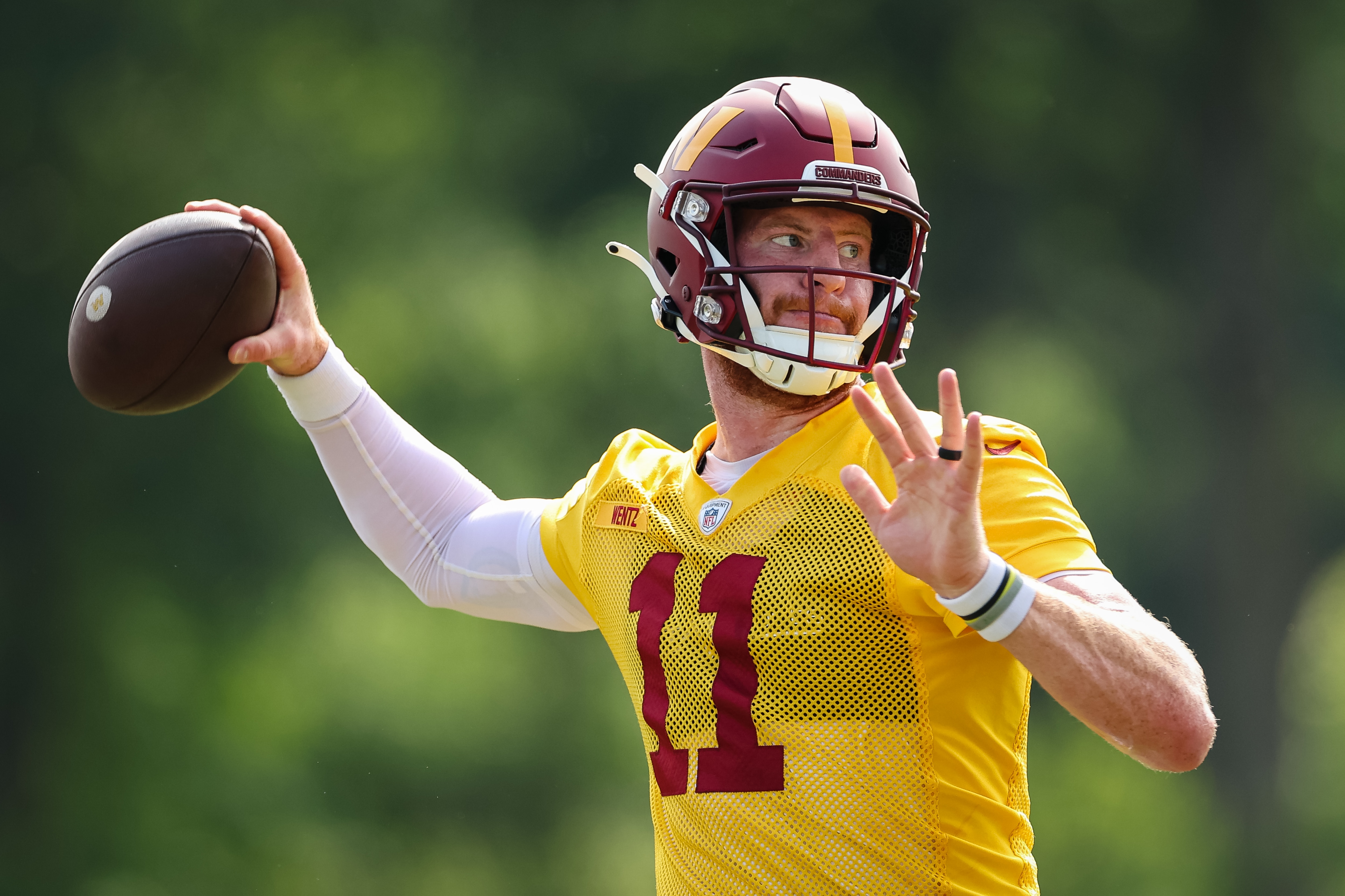 ASHBURN, VA - JUNE 16: Carson Wentz #11 of the Washington Commanders participates in a drill during the organized team activity at INOVA Sports Performance Center on June 16, 2022 in Ashburn, Virginia. (Photo by Scott Taetsch/Getty Images)