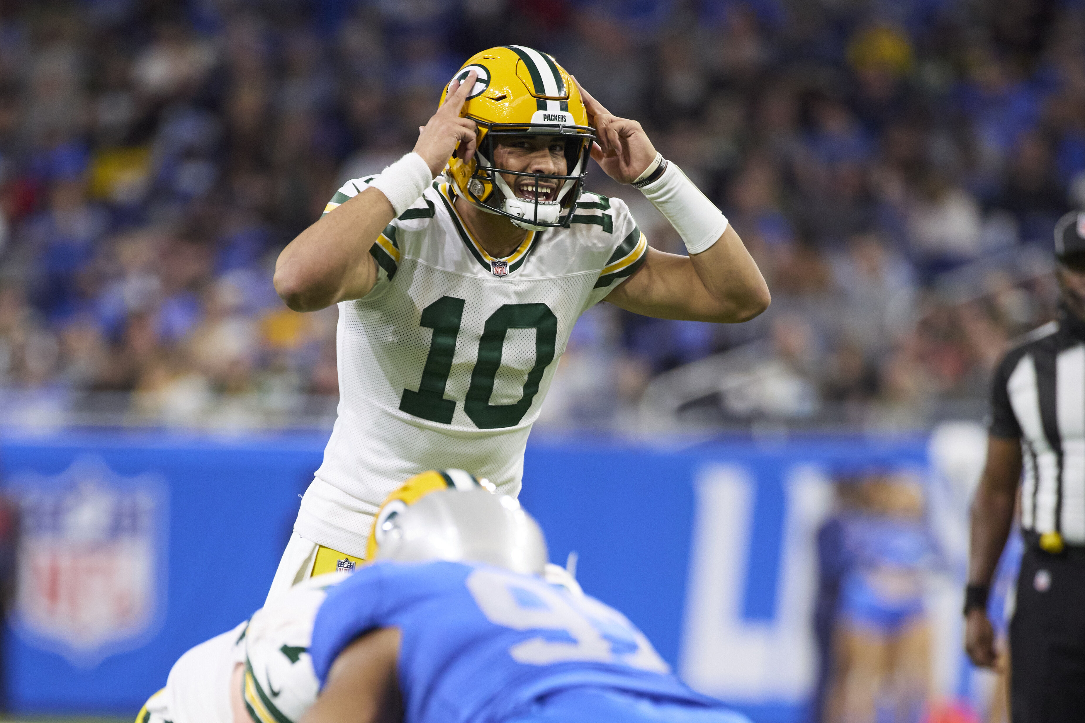 Green Bay Packers quarterback Jordan Love (10) gets set to run a play against the Detroit Lions during an NFL football game, Sunday, Jan. 9, 2022, in Detroit. (AP Photo/Rick Osentoski)