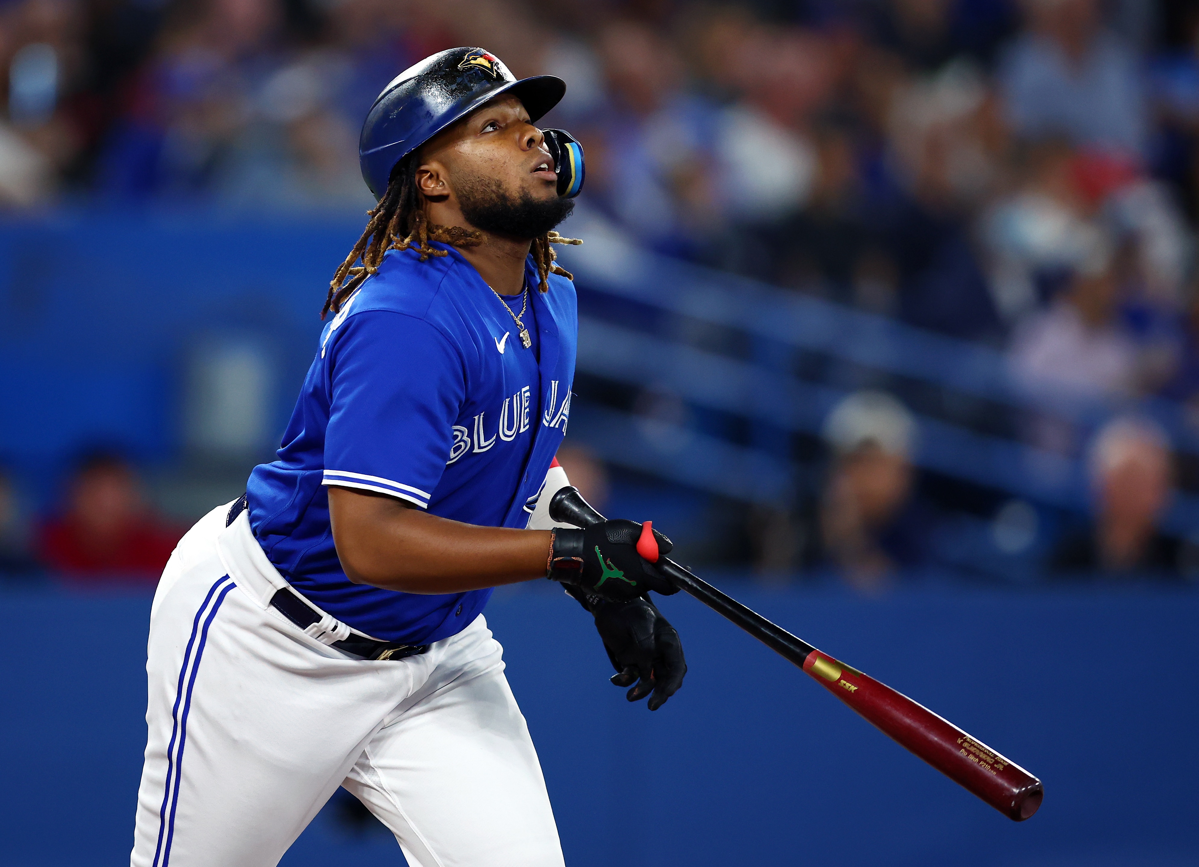 TORONTO, ON - JUNE 29:  Vladimir Guerrero Jr. #27 of the Toronto Blue Jays watches his ball during a MLB game against the Boston Red Sox at Rogers Centre on June 29, 2022 in Toronto, Ontario, Canada.  (Photo by Vaughn Ridley/Getty Images)