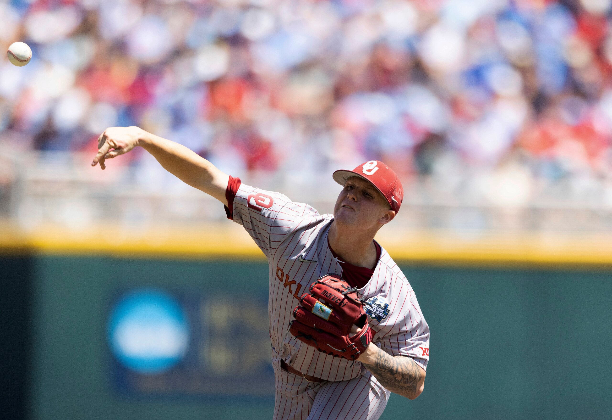 Oklahoma starting pitcher Cade Horton throws against Mississippi in the first inning in Game 2 of the NCAA College World Series baseball finals, Sunday, June 26, 2022, in Omaha, Neb. (AP Photo/Rebecca S. Gratz)
