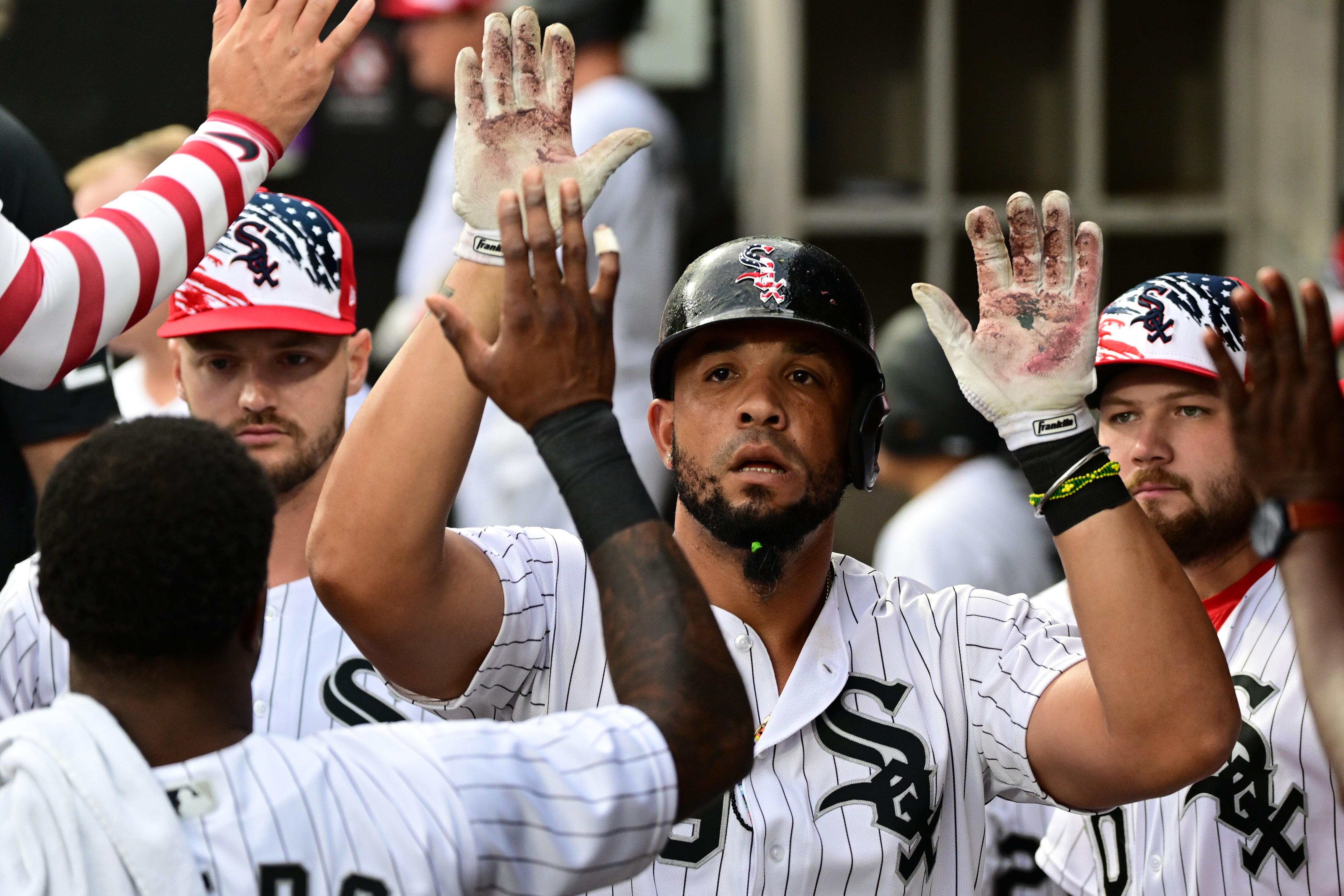 CHICAGO, ILLINOIS - JULY 04: Jose Abreu #79 of the Chicago White Sox celebrates in the dugout with teammates after his home run in the second inning against the Minnesota Twins at Guaranteed Rate Field on July 04, 2022 in Chicago, Illinois. (Photo by Quinn Harris/Getty Images)