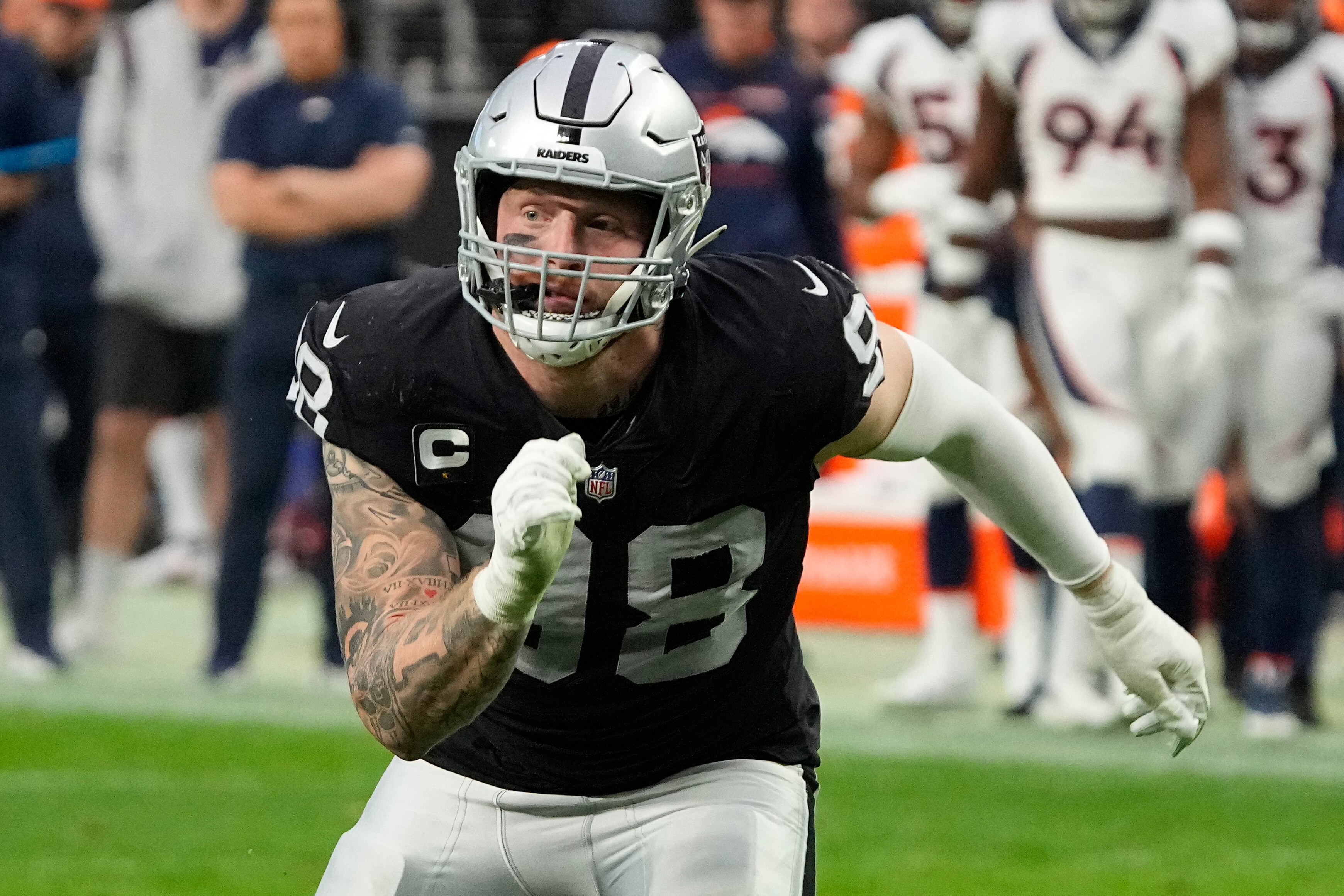 FILE - Las Vegas Raiders defensive end Maxx Crosby (98) plays against the Denver Broncos during the first half of an NFL football game Dec. 26, 2021, in Las Vegas. The Raiders signed star defensive end Crosby to a four-year extension worth about $95 million in the first major personnel move made by the new regime of coach Josh McDaniels and general manager Dave Ziegler. (AP Photo/Rick Scuteri, File)