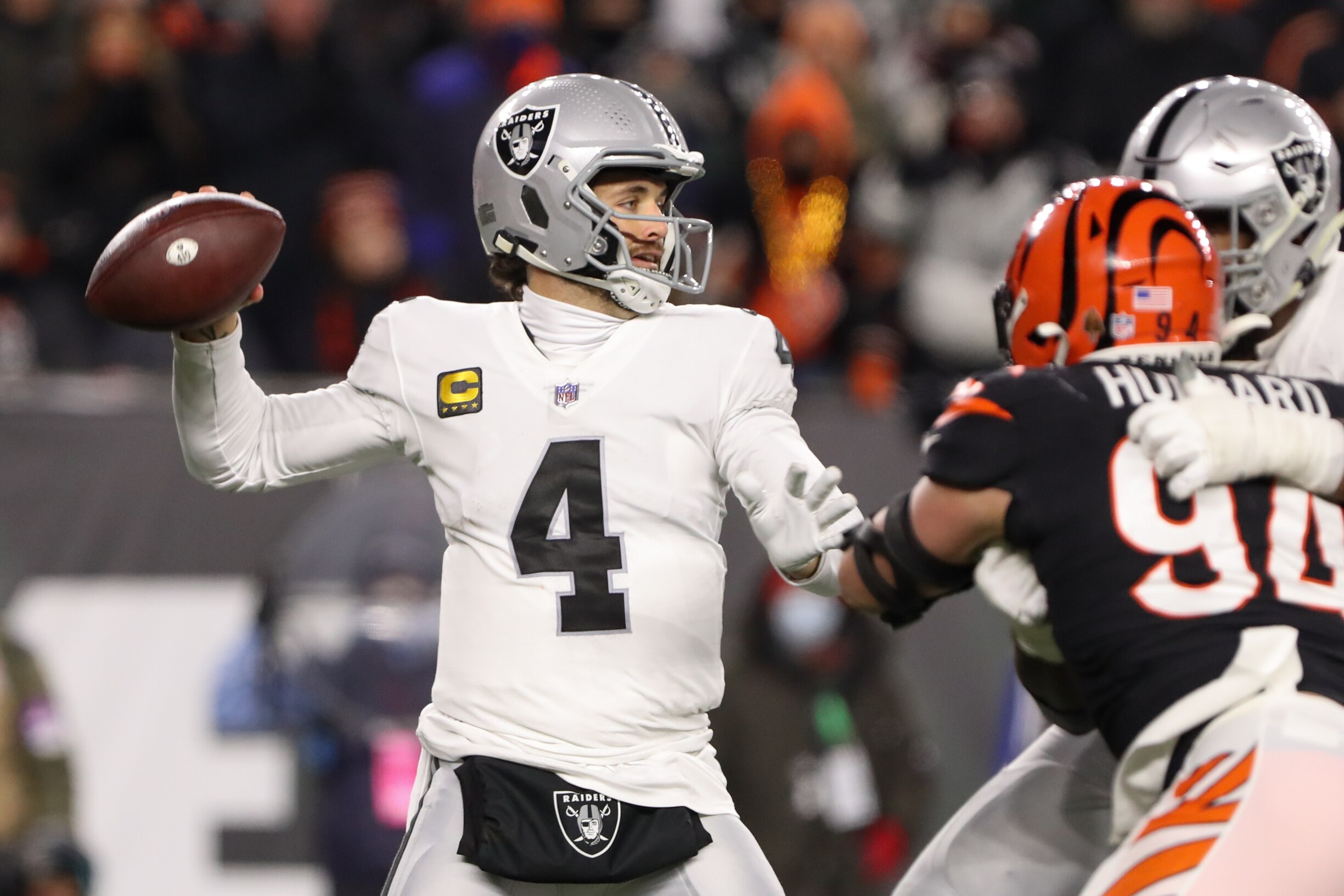 CINCINNATI, OH - JANUARY 15: Las Vegas Raiders quarterback Derek Carr (4) passes the ball during the Wild Card game against the Las Vegas Raiders and the Cincinnati Bengals on January 15, 2022, at Paul Brown Stadium in Cincinnati, OH. (Photo by Ian Johnson/Icon Sportswire via Getty Images)