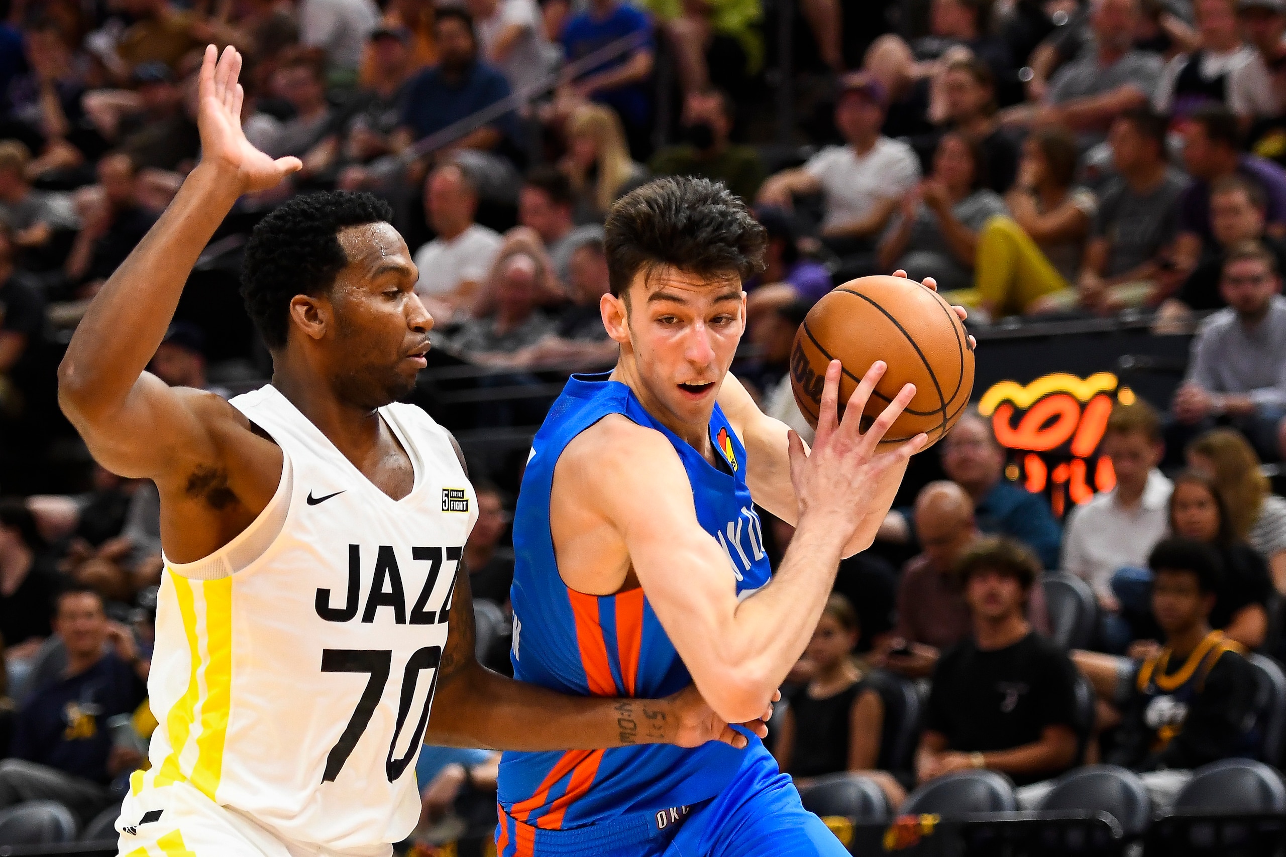 SALT LAKE CITY, UTAH - JULY 05: Chet Holmgren #7 of the Oklahoma City Thunder drives against Vic Law #70 of the Utah Jazz during a NBA Summer League game at Vivint Arena on July 05, 2022 in Salt Lake City, Utah. NOTE TO USER: User expressly acknowledges and agrees that, by downloading and/or using this Photograph, user is consenting to the terms and conditions of the Getty Images License Agreement. (Photo by Alex Goodlett/Getty Images)