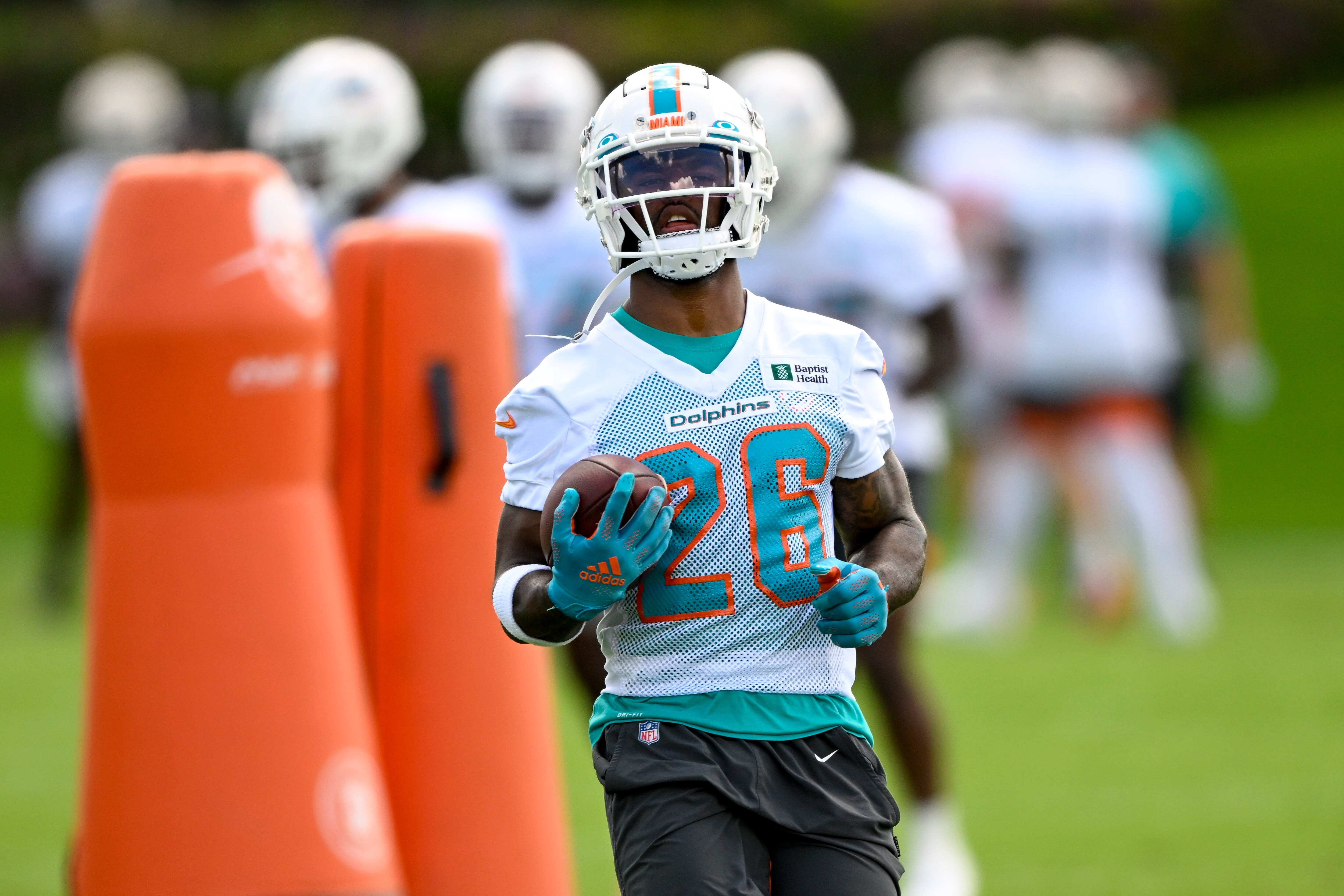 DAVIE, FL - JUNE 01: Miami Dolphins running back Salvon Ahmed (26) runs with the ball during the first mandatory  minicamp at the Baptist Health Training Complex on June 1, 2022, in Miami Gardens, Florida. (Photo by Doug Murray/Icon Sportswire via Getty Images)