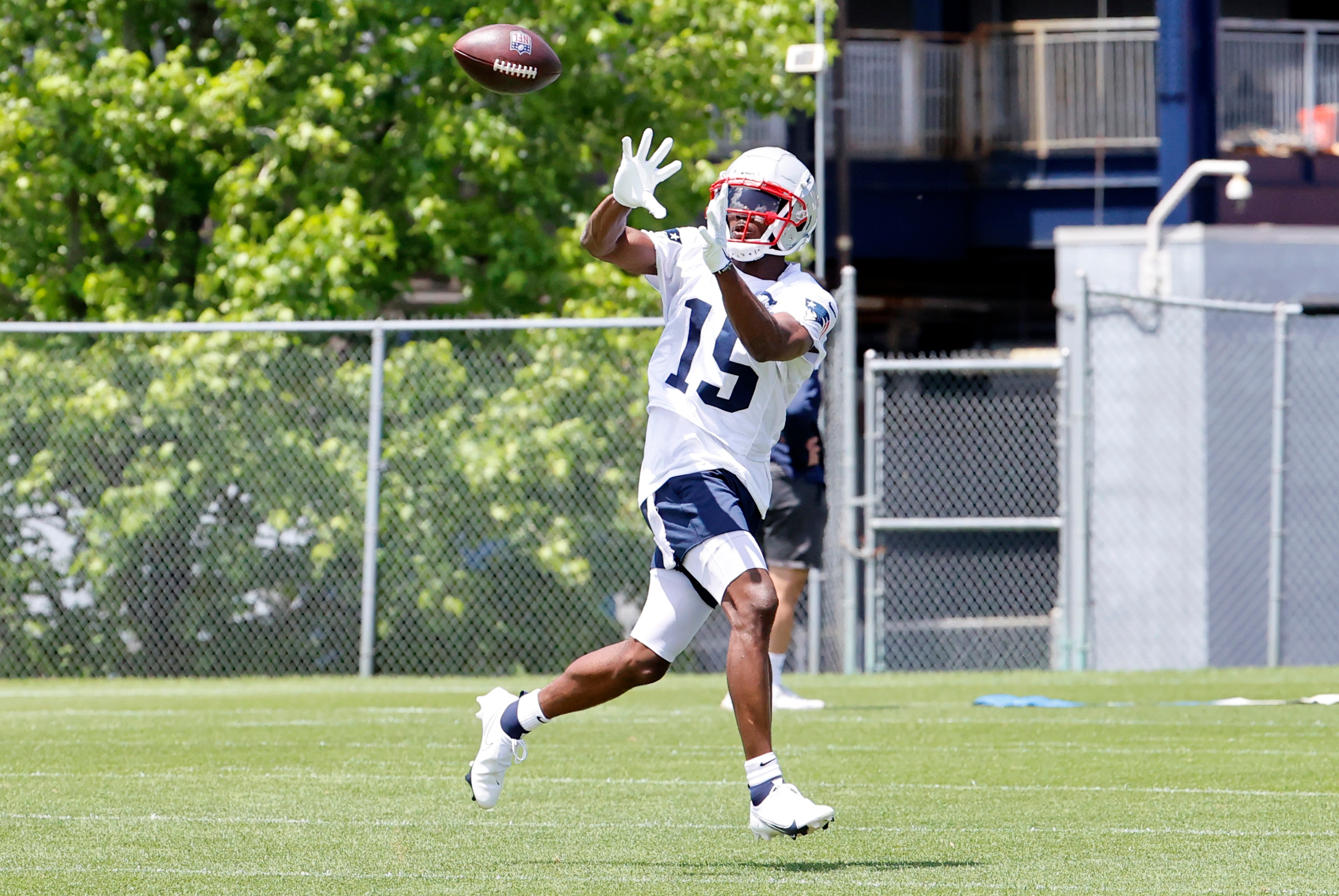 FOXBOROUGH, MA - JUNE 08: New England Patriots wide receiver Nelson Agholor (15) eyes a catch during Day 2 of mandatory New England Patriots minicamp on June 8, 2022, at the Patriots Training Facility at Gillette Stadium in Foxborough, Massachusetts. (Photo by Fred Kfoury III/Icon Sportswire via Getty Images)