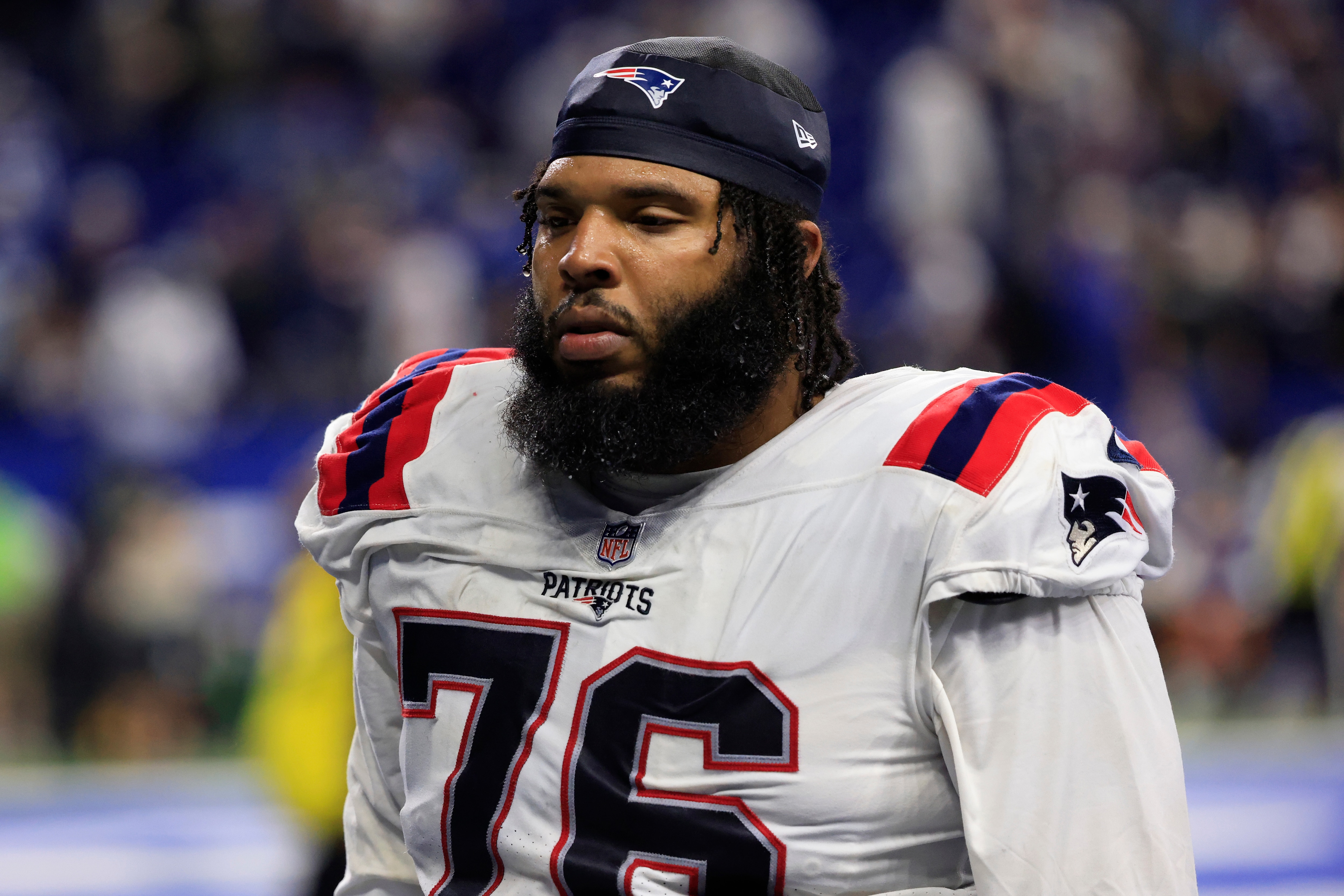 INDIANAPOLIS, INDIANA - DECEMBER 18: Isaiah Wynn #76 of the New England Patriots walks off the field after a loss to the Indianapolis Colts at Lucas Oil Stadium on December 18, 2021 in Indianapolis, Indiana. (Photo by Justin Casterline/Getty Images)