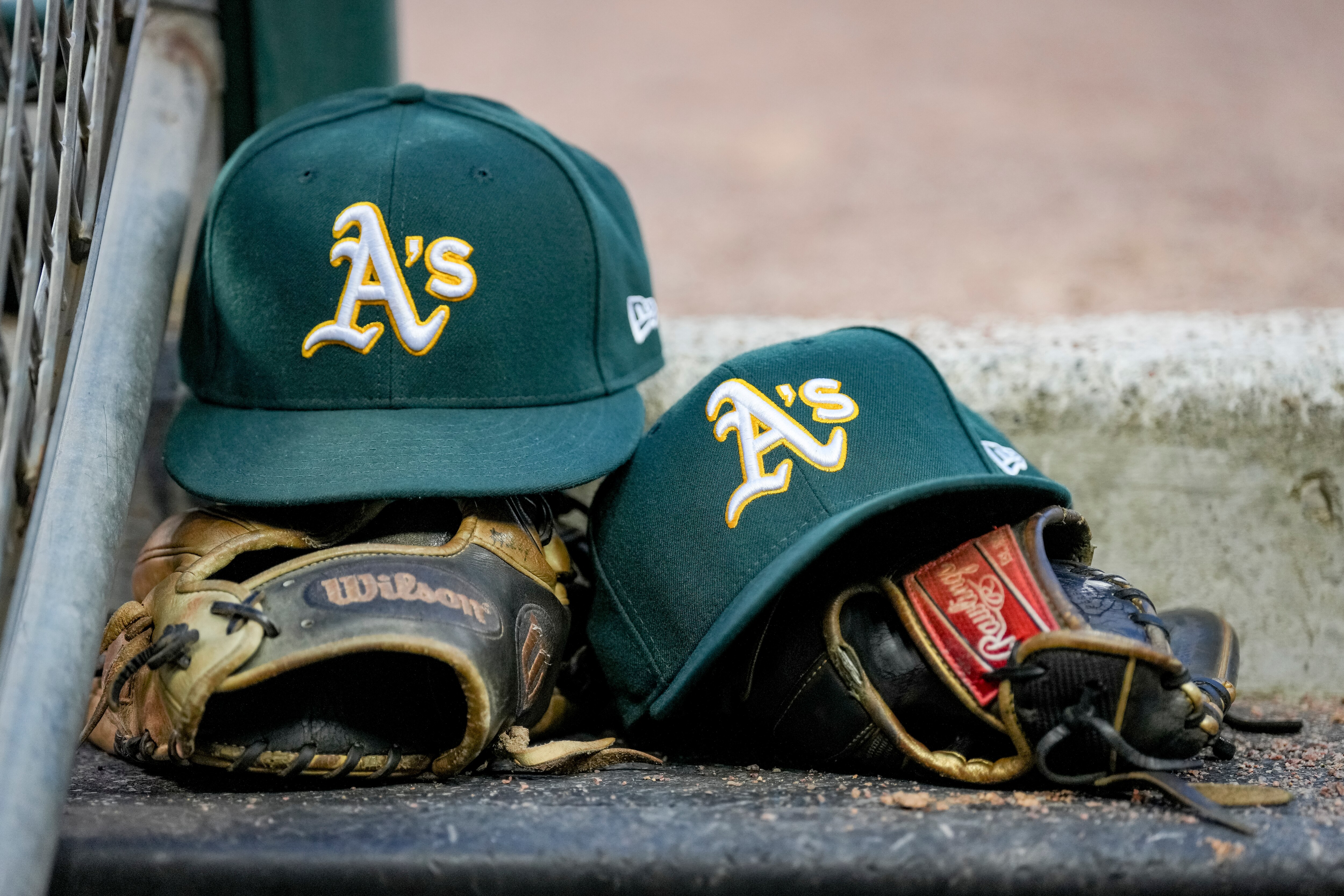 DETROIT, MICHIGAN - MAY 11: New Era Oakland Athletics hats and Wilson gloves and mitts are pictured during the game against the Detroit Tigers at Comerica Park on May 11, 2022 in Detroit, Michigan. (Photo by Nic Antaya/Getty Images)