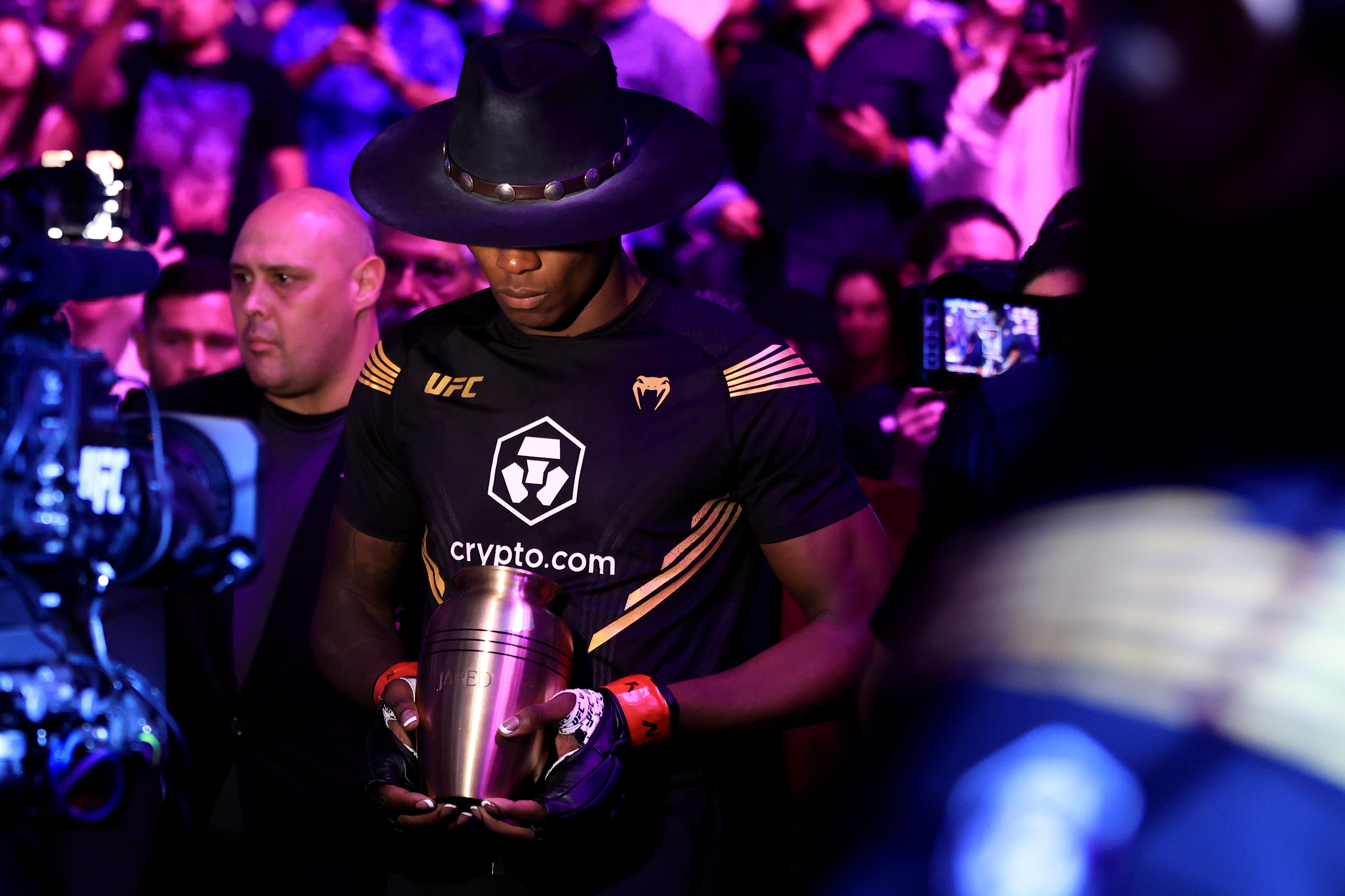 LAS VEGAS, NEVADA - JULY 02: Israel Adesanya of Nigeria prepares to enter the octagon for his middleweight title bout against Jared Cannonier during UFC 276 at T-Mobile Arena on July 02, 2022 in Las Vegas, Nevada. (Photo by Carmen Mandato/Getty Images)