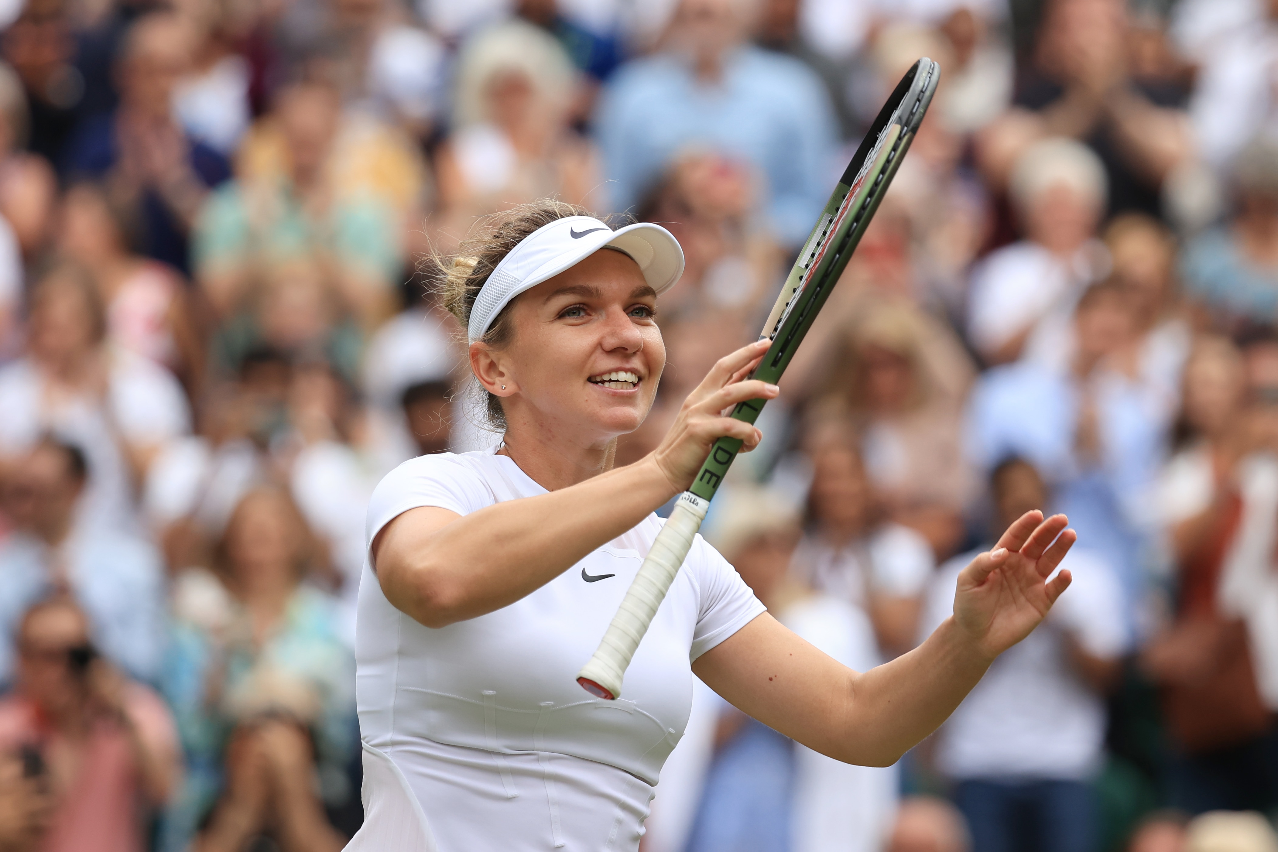 LONDON, ENGLAND - JULY 06: Simona Halep (ROU) celebrates victory over Amanda Anisimova (USA) in their Ladies' Singles Quarter Final match during day ten of The Championships Wimbledon 2022 at All England Lawn Tennis and Croquet Club on July 6, 2022 in London, England. (Photo by Simon Stacpoole/Offside/Offside via Getty Images)