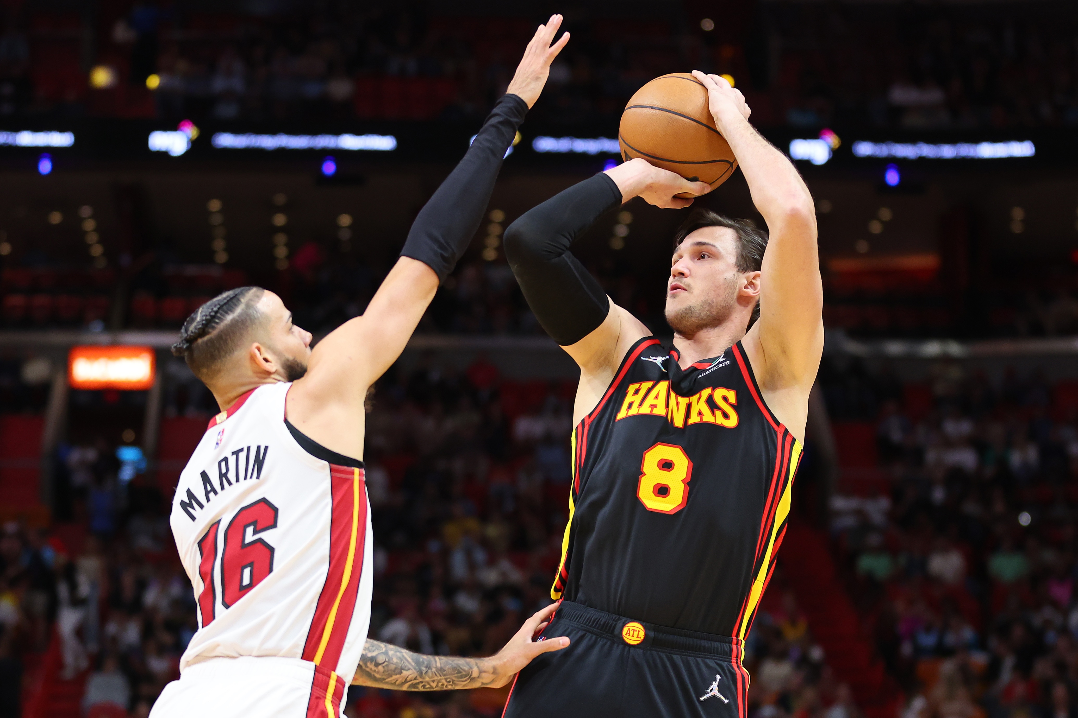 MIAMI, FLORIDA - APRIL 08: Danilo Gallinari #8 of the Atlanta Hawks shoots over Caleb Martin #16 of the Miami Heat during the first half at FTX Arena on April 08, 2022 in Miami, Florida. NOTE TO USER: User expressly acknowledges and agrees that, by downloading and or using this photograph, User is consenting to the terms and conditions of the Getty Images License Agreement.  (Photo by Michael Reaves/Getty Images)
