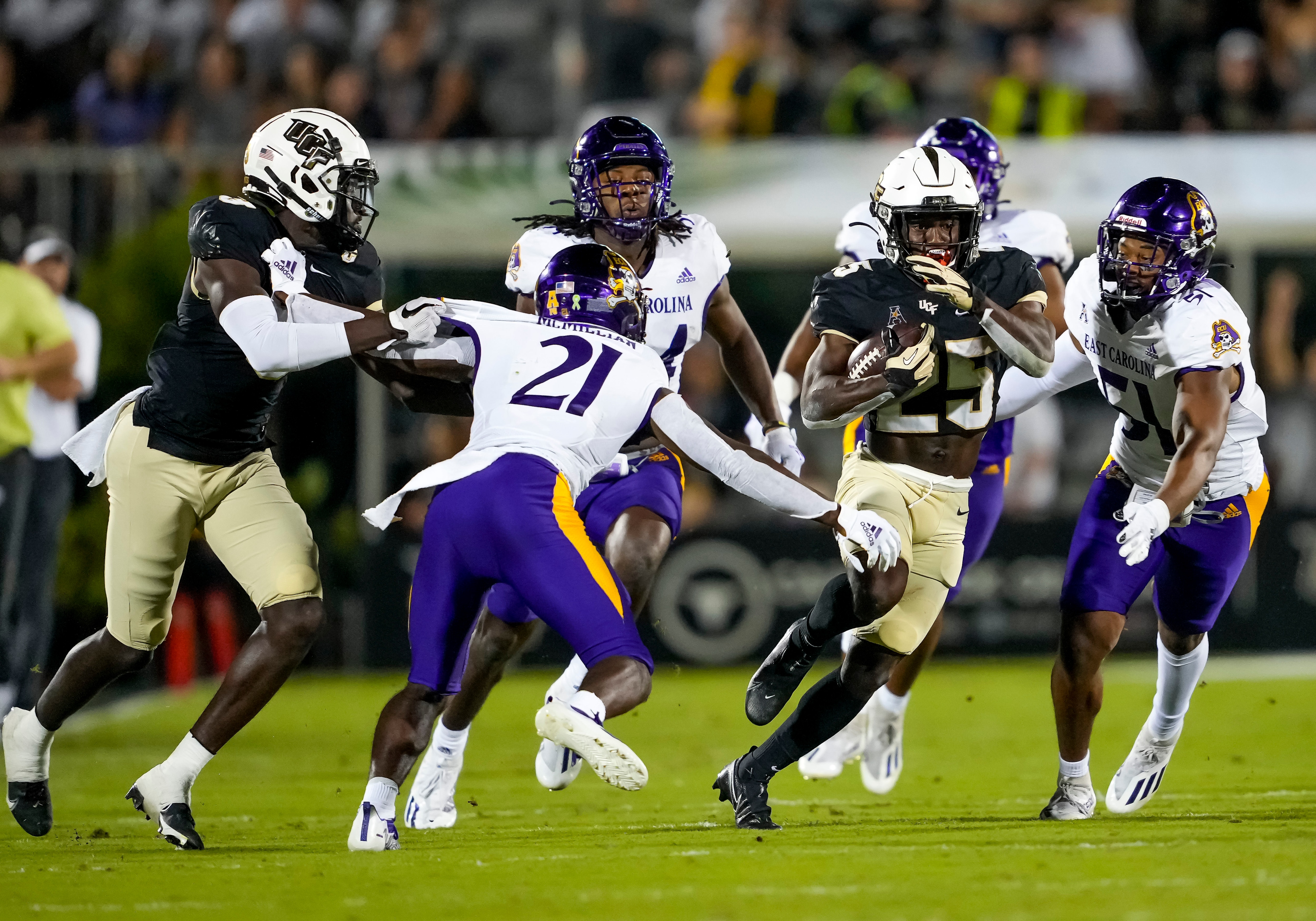 ORLANDO, FL - OCTOBER 09: UCF Knights running back Johnny Richardson (25) runs the ball for 49 yards during the football game between the UCF Knights and East Carolina on October 9th, 2022 at Bright House Networks Stadium in Orlando, FL. (Photo by Andrew Bershaw/Icon Sportswire via Getty Images)