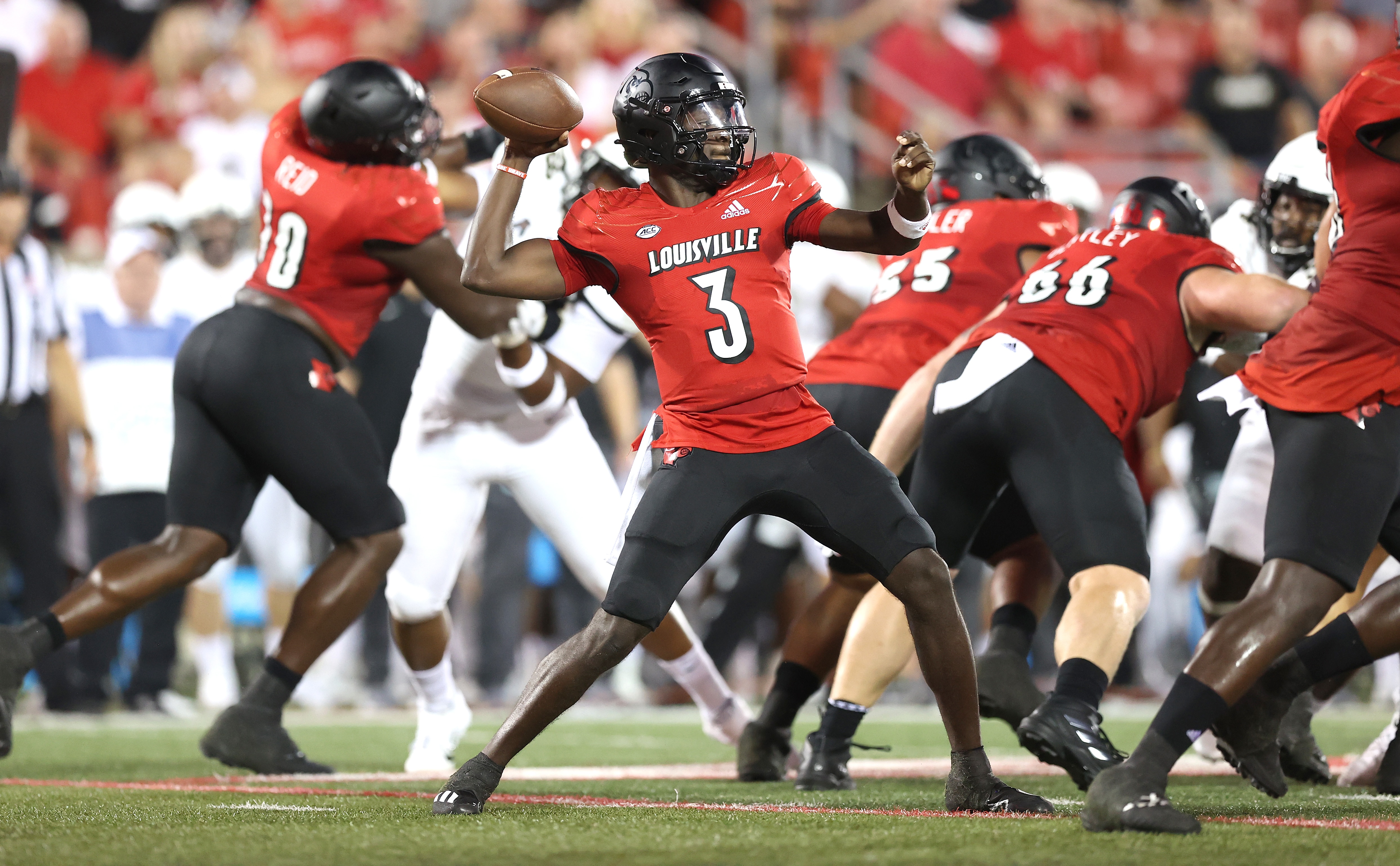 LOUISVILLE, KENTUCKY - SEPTEMBER 17: Malik Cunningham #3 of the Louisville Cardinals throws a pass against the UCF Knights at Cardinal Stadium on September 17, 2021 in Louisville, Kentucky. (Photo by Andy Lyons/Getty Images)