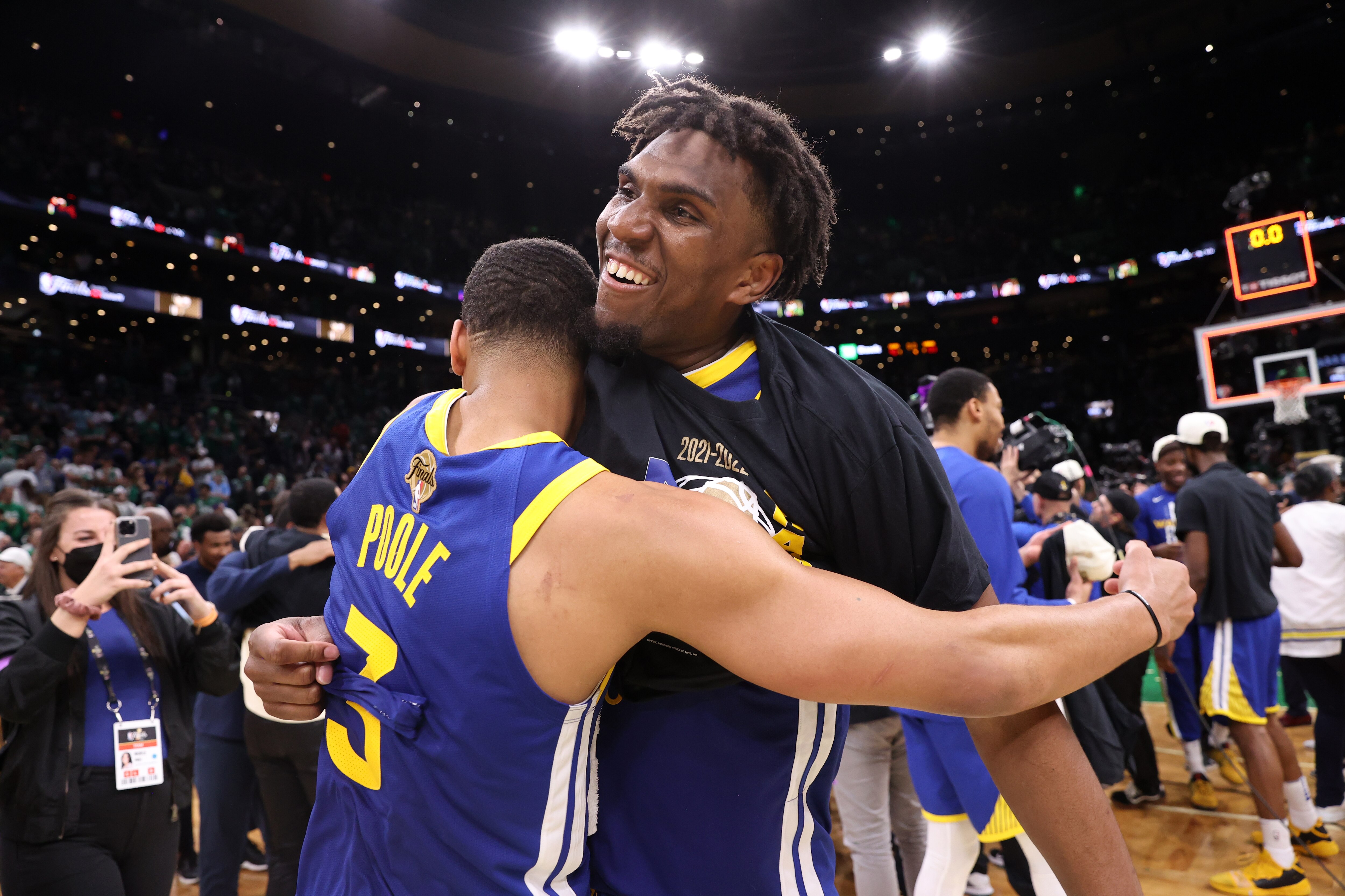 BOSTON, MA - JUNE 16: Kevon Looney #5 of the Golden State Warriors embraces Jordan Poole #3 of the Golden State Warriors after Game Six of the 2022 NBA Finals on June 16, 2022 at TD Garden in Boston, Massachusetts. NOTE TO USER: User expressly acknowledges and agrees that, by downloading and or using this photograph, user is consenting to the terms and conditions of Getty Images License Agreement. Mandatory Copyright Notice: Copyright 2022 NBAE (Photo by Joe Murphy/NBAE via Getty Images)