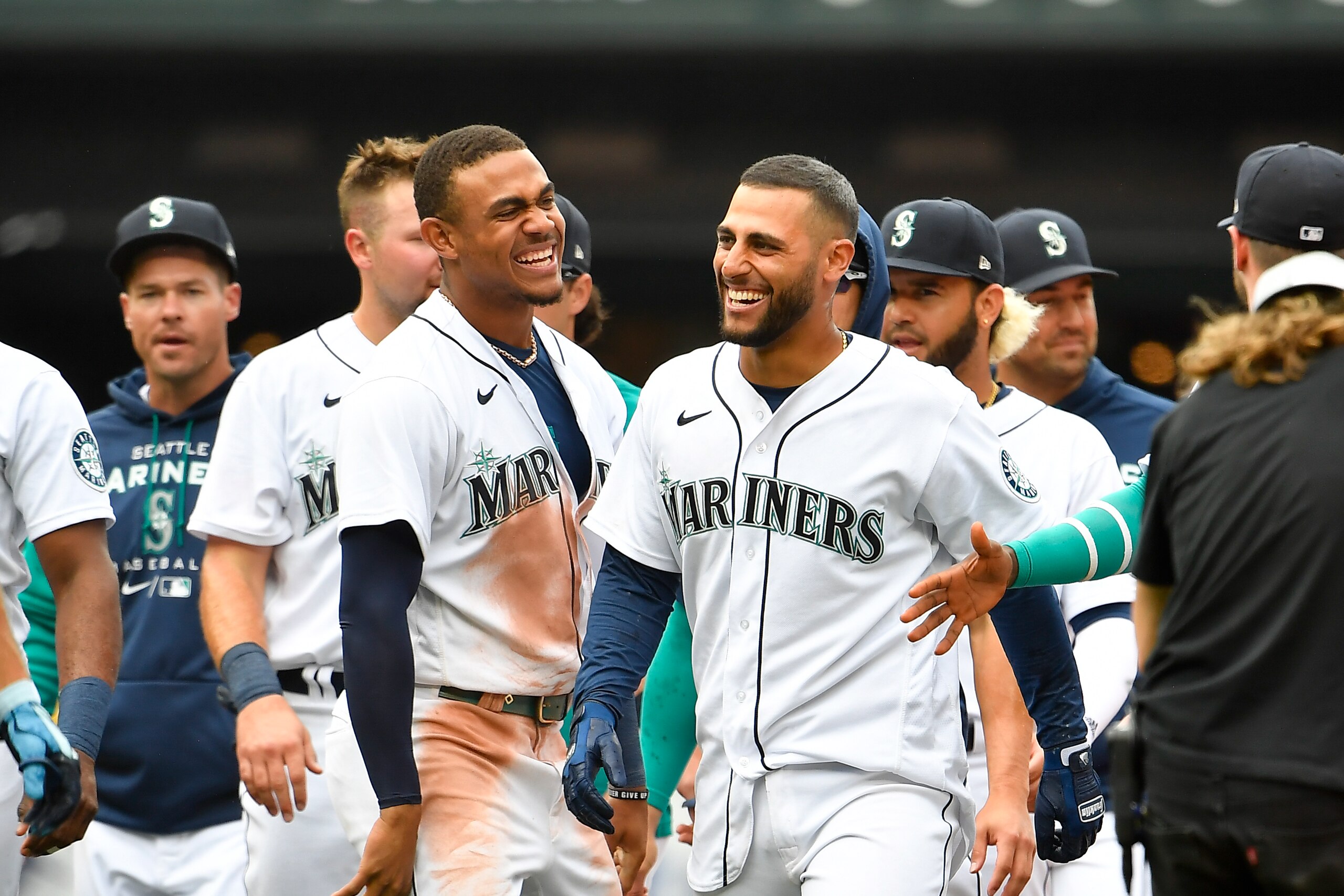 SEATTLE, WASHINGTON - JULY 02: Abraham Toro #13 of the Seattle Mariners celebrates with teammates after hitting the game winning RBI single during the ninth inning against the Oakland Athletics at T-Mobile Park on July 02, 2022 in Seattle, Washington. The Seattle Mariners won 2-1. (Photo by Alika Jenner/Getty Images)