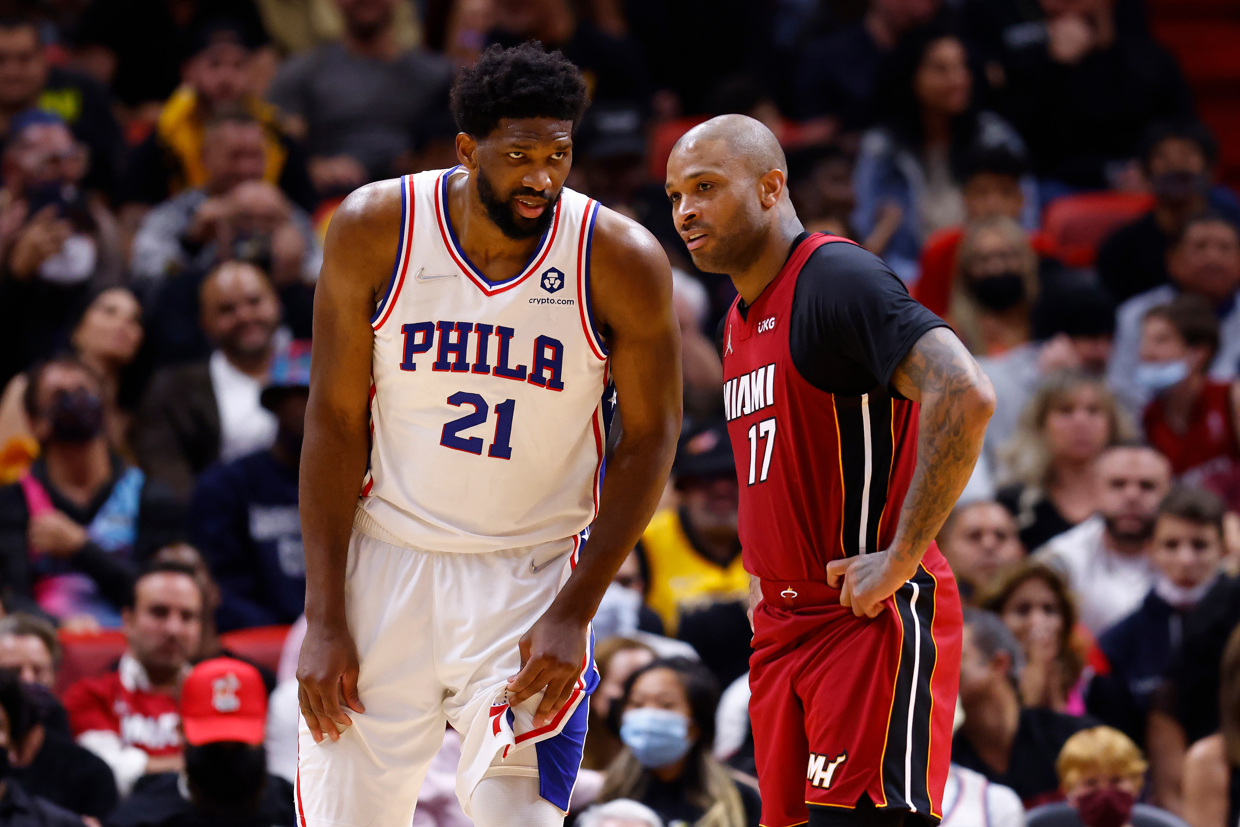 MIAMI, FLORIDA - JANUARY 15: Joel Embiid #21 of the Philadelphia 76ers talks with P.J. Tucker #17 of the Miami Heat during the fourth quarter at FTX Arena on January 15, 2022 in Miami, Florida. NOTE TO USER: User expressly acknowledges and agrees that, by downloading and or using this photograph, User is consenting to the terms and conditions of the Getty Images License Agreement. (Photo by Michael Reaves/Getty Images)