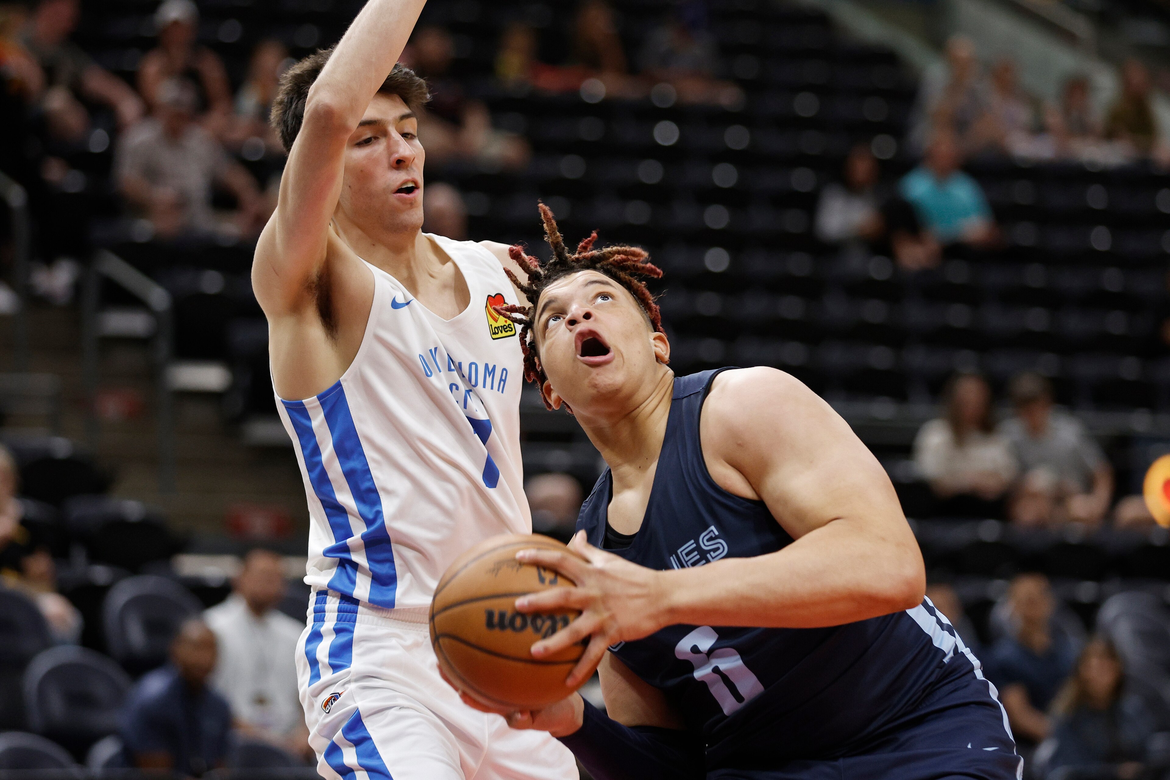 Memphis Grizzlies forward Kenny Lofton Jr. (6) looks to shoot against Oklahoma City Thunder forward Chet Holmgren (7) during the first half of an NBA summer league basketball game Wednesday, July 6, 2022, in Salt Lake City. (AP Photo/Jeff Swinger) Memphis Grizzlies forward Kenny Lofton Jr. (6) looks to shoot against Oklahoma City Thunder forward Chet Holmgren (7) during the first half of an NBA summer league basketball game Wednesday, July 6, 2022, in Salt Lake City. (AP Photo/Jeff Swinger)