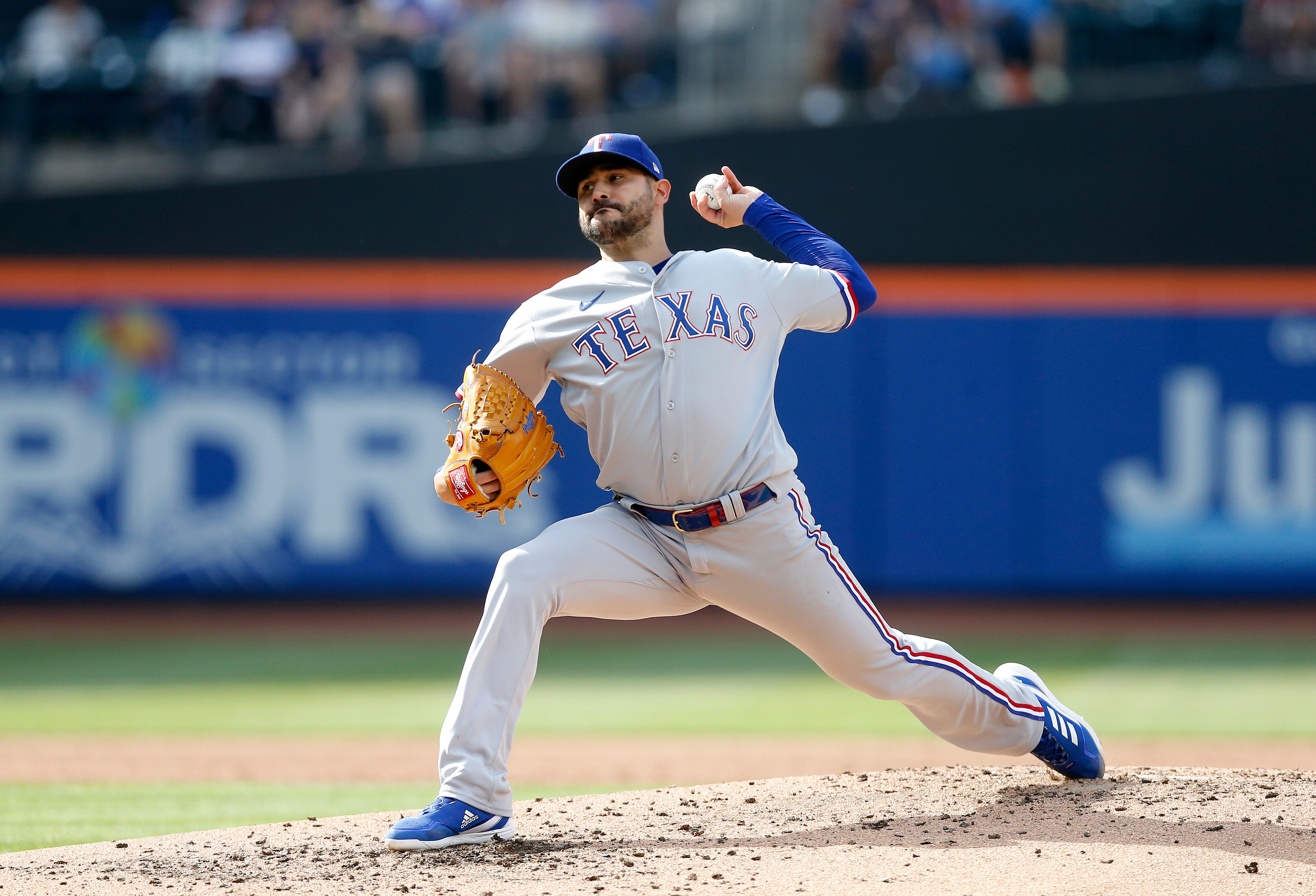 NEW YORK, NEW YORK - JULY 02:  Martin Perez #54 of the Texas Rangers in action against the New York Mets at Citi Field on July 02, 2022 in New York City. The Rangers defeated the Mets 7-3. (Photo by Jim McIsaac/Getty Images)