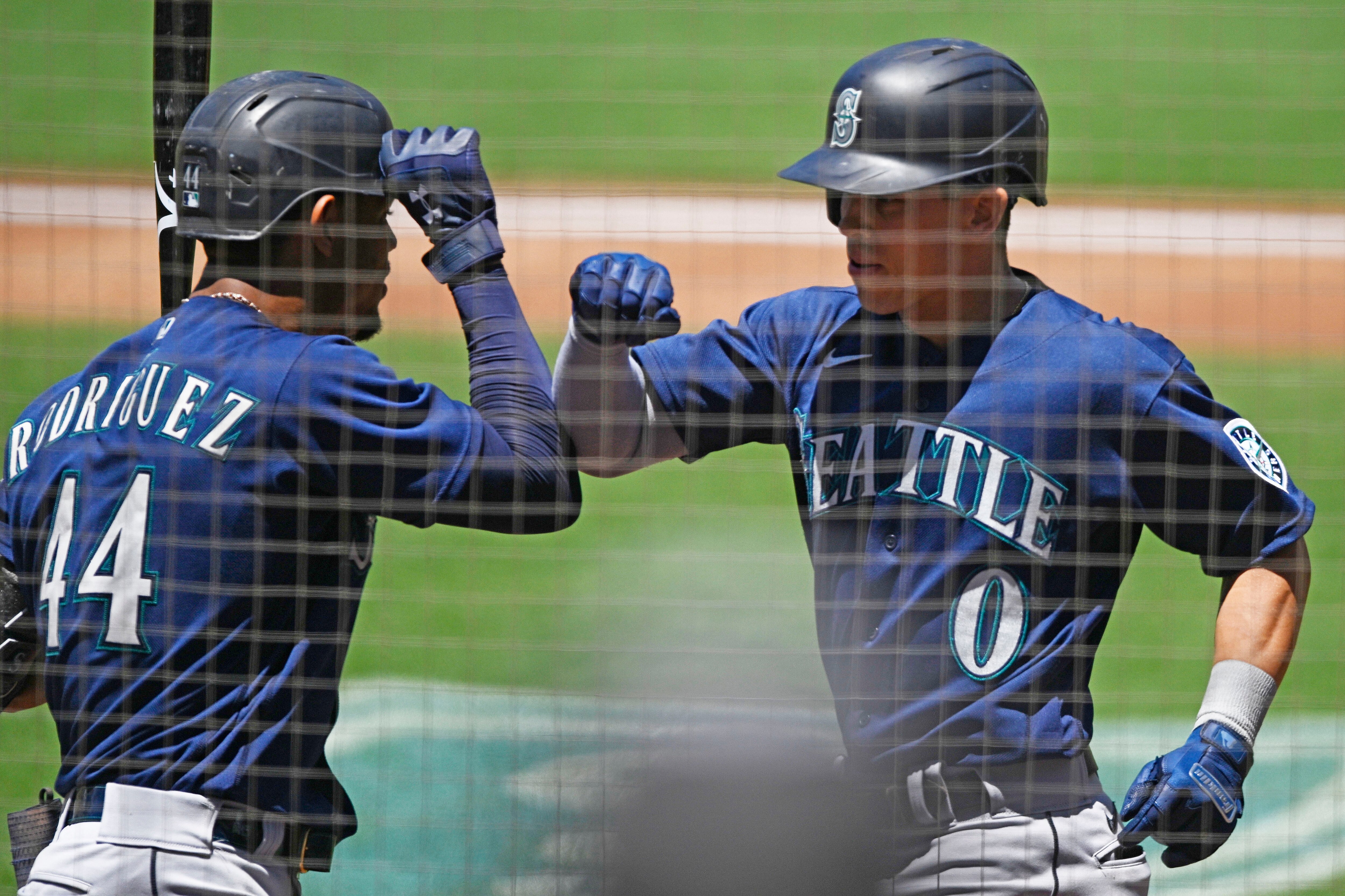SAN DIEGO, CA - JULY 5:   Sam Haggerty #0 of the Seattle Mariners, right, is congratulated by Julio Rodriguez #44 after hitting a solo home run during the third inning of a baseball game against the San Diego Padres July 5, 2022 at Petco Park in San Diego, California. (Photo by Denis Poroy/Getty Images)