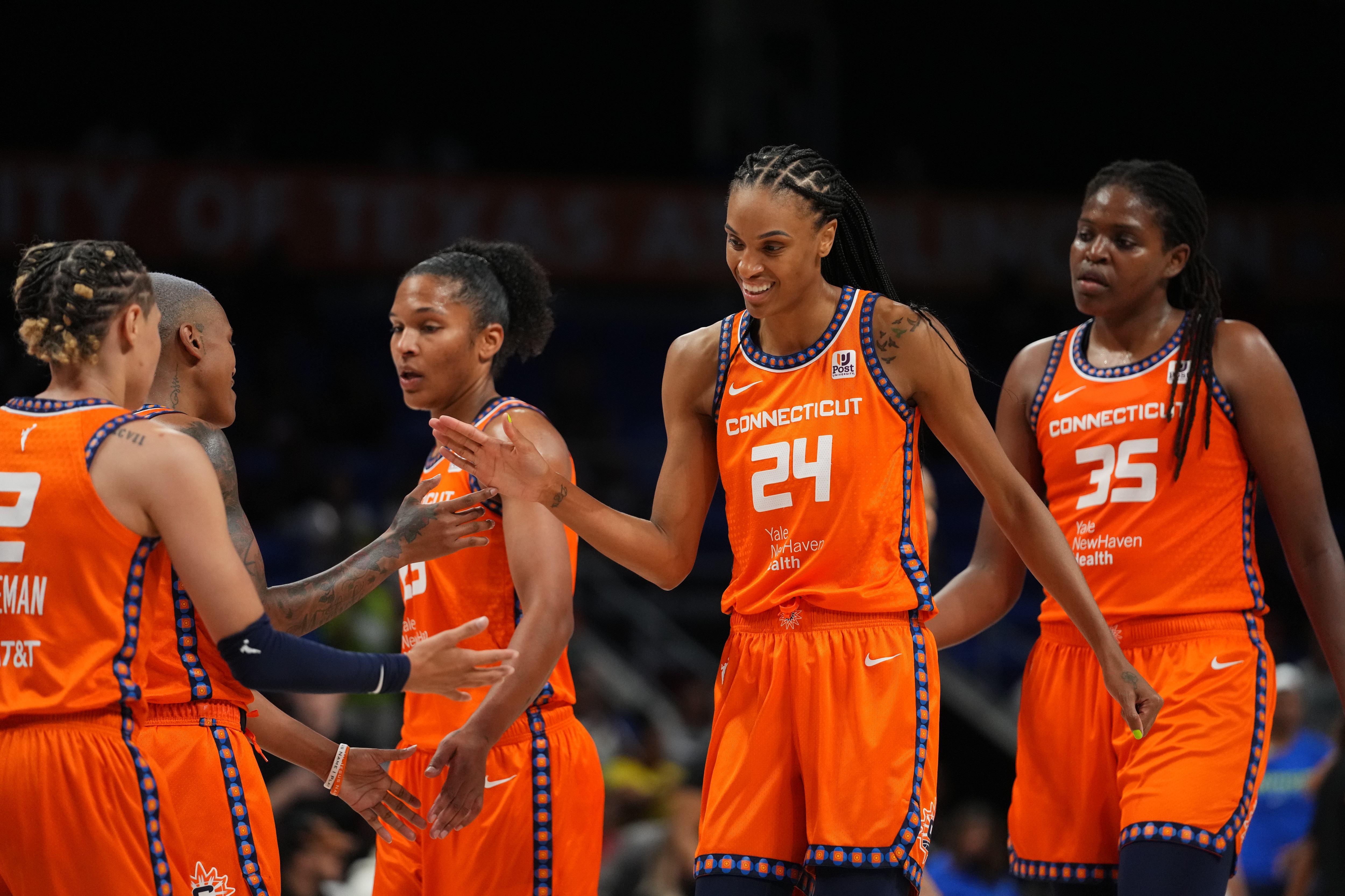 ARLINGTON, TX - JULY 5: DeWanna Bonner #24 of the Connecticut Sun is congratulated by teammates during the game against the Dallas Wings on July 5, 2022 at the College Park Center in Arlington, Texas. NOTE TO USER: User expressly acknowledges and agrees that, by downloading and/or using this Photograph, user is consenting to the terms and conditions of the Getty Images License Agreement. Mandatory Copyright Notice: Copyright 2022 NBAE (Photo by Cooper Neill/NBAE via Getty Images)
