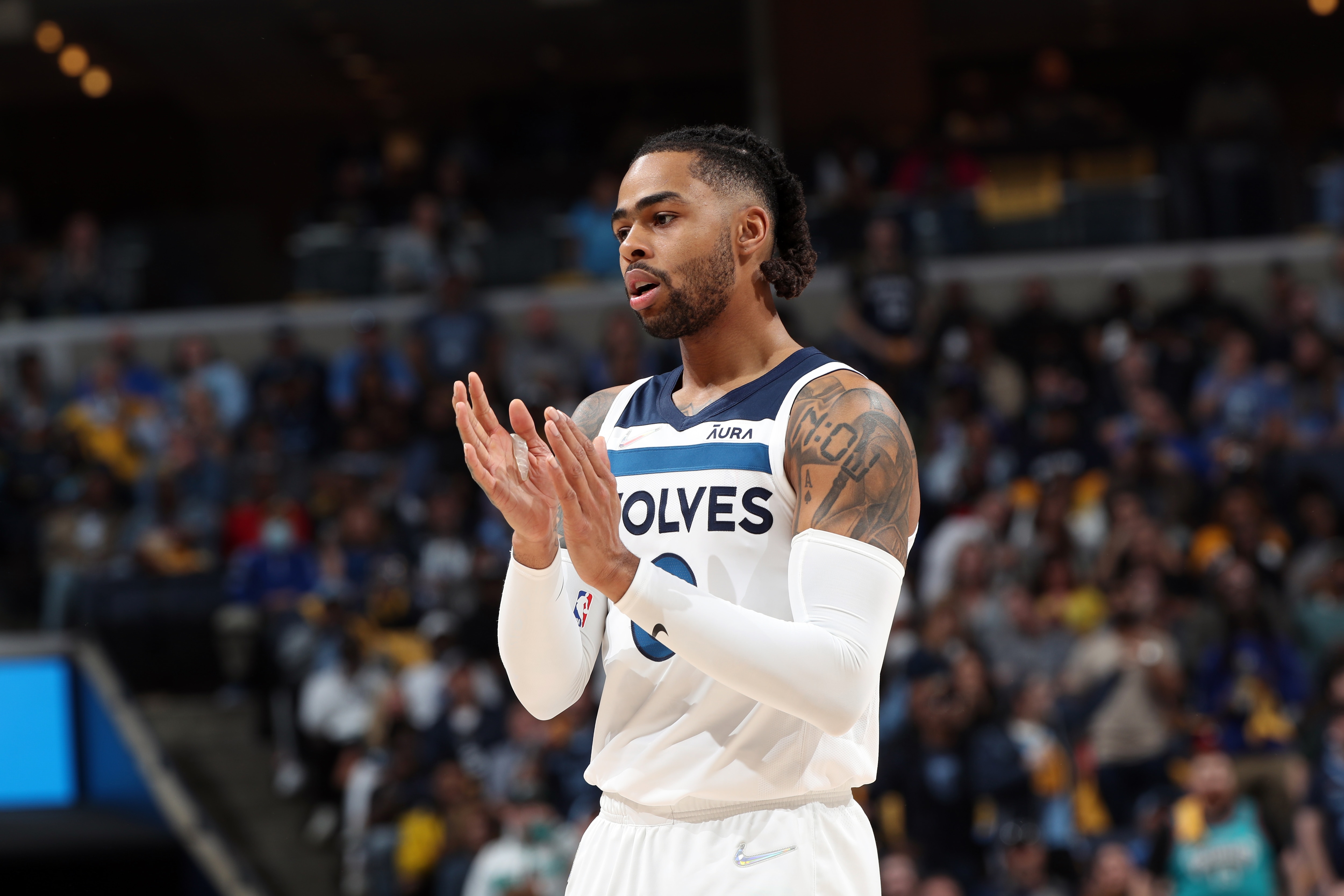 MEMPHIS, TN - APRIL 26: D'Angelo Russell #0 of the Minnesota Timberwolves celebrates against the Memphis Grizzlies during Round 1 Game 5 of the 2022 NBA Playoffs on April 26, 2022 at FedExForum in Memphis, Tennessee. NOTE TO USER: User expressly acknowledges and agrees that, by downloading and or using this photograph, User is consenting to the terms and conditions of the Getty Images License Agreement. Mandatory Copyright Notice: Copyright 2022 NBAE (Photo by Joe Murphy/NBAE via Getty Images) MEMPHIS, TN - APRIL 26: D'Angelo Russell #0 of the Minnesota Timberwolves celebrates against the Memphis Grizzlies during Round 1 Game 5 of the 2022 NBA Playoffs on April 26, 2022 at FedExForum in Memphis, Tennessee. NOTE TO USER: User expressly acknowledges and agrees that, by downloading and or using this photograph, User is consenting to the terms and conditions of the Getty Images License Agreement. Mandatory Copyright Notice: Copyright 2022 NBAE (Photo by Joe Murphy/NBAE via Getty Images)