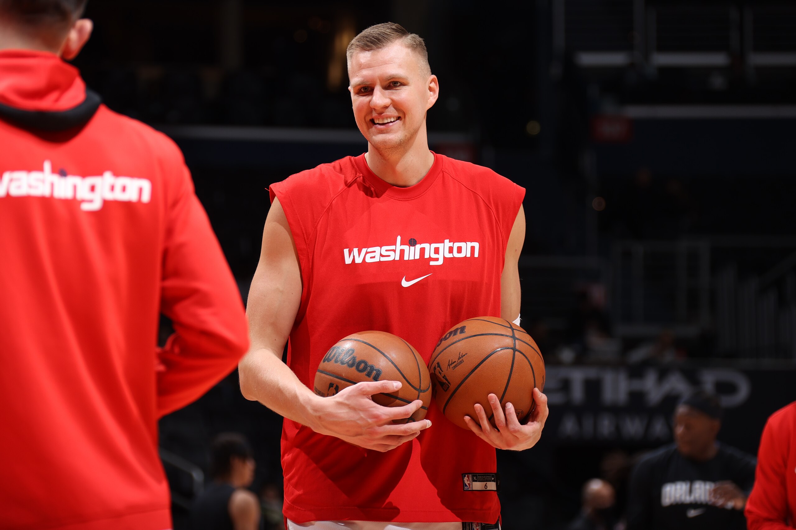 WASHINGTON, DC -ย MARCH 30: Kristaps Porzingis #6 of the Washington Wizards smiles before the game against the Orlando Magic on March 30, 2022 at Capital One Arena in Washington, DC. NOTE TO USER: User expressly acknowledges and agrees that, by downloading and or using this Photograph, user is consenting to the terms and conditions of the Getty Images License Agreement. Mandatory Copyright Notice: Copyright 2022 NBAE (Photo by Stephen Gosling/NBAE via Getty Images) WASHINGTON, DC -ย MARCH 30: Kristaps Porzingis #6 of the Washington Wizards smiles before the game against the Orlando Magic on March 30, 2022 at Capital One Arena in Washington, DC. NOTE TO USER: User expressly acknowledges and agrees that, by downloading and or using this Photograph, user is consenting to the terms and conditions of the Getty Images License Agreement. Mandatory Copyright Notice: Copyright 2022 NBAE (Photo by Stephen Gosling/NBAE via Getty Images)